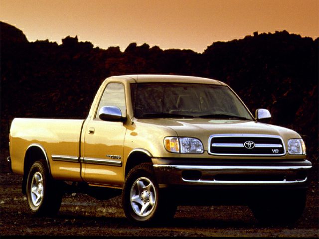Front side view of a single cab pickup truck with V8 badge