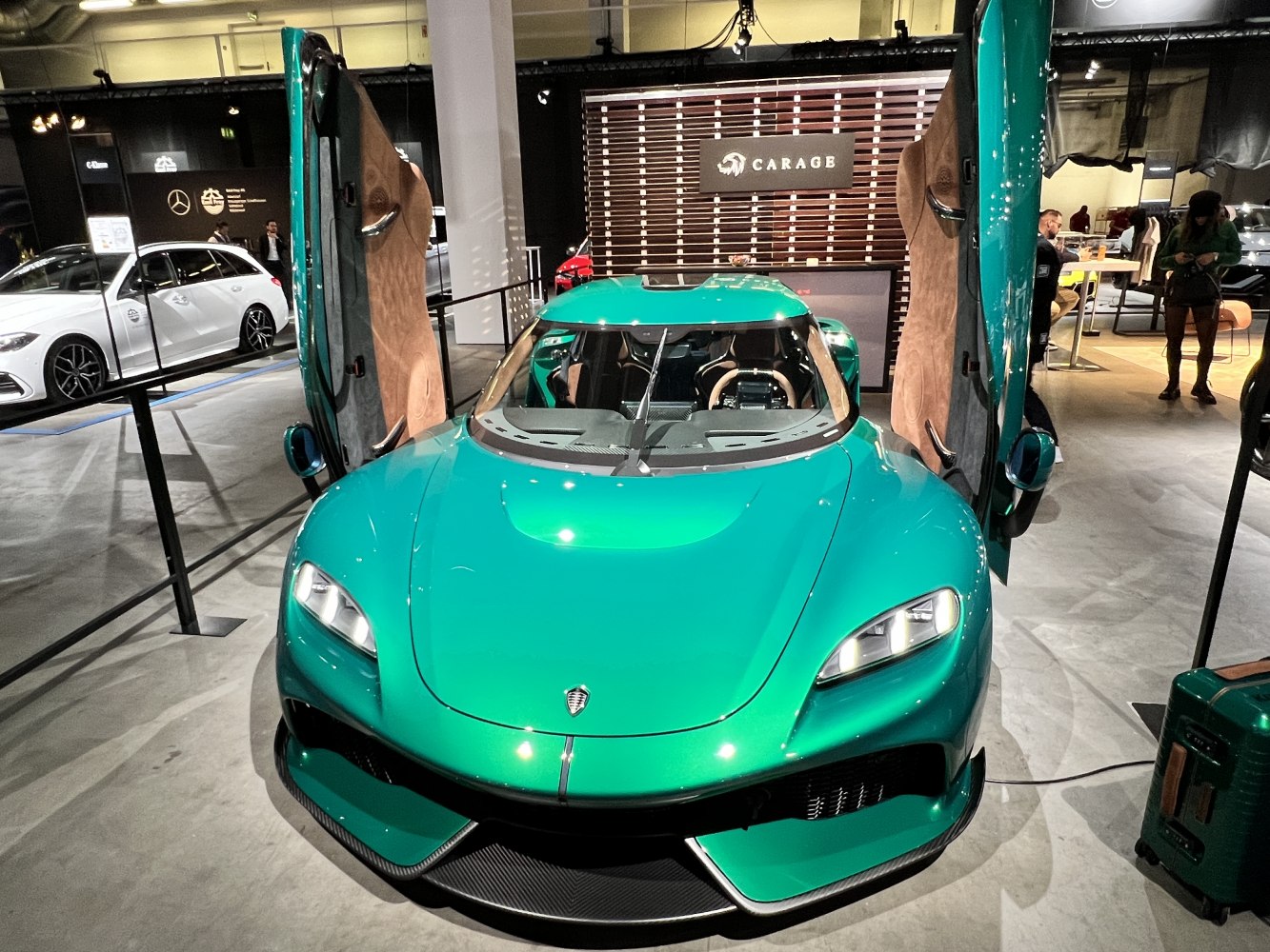 Front view with dihedral doors open and sporty aerodynamic design