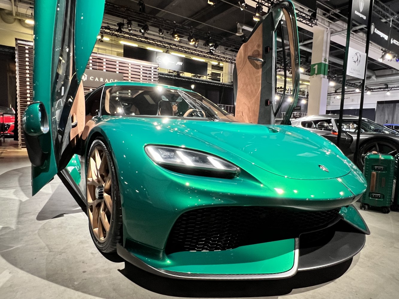 Butterfly doors and aerodynamic front design on a sleek sports vehicle