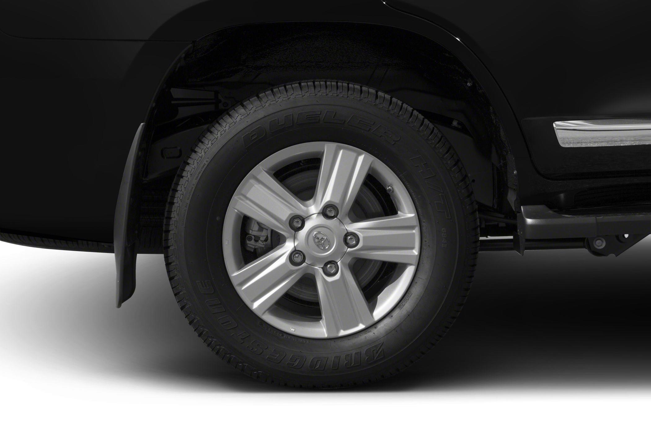 Alloy wheel with Bridgestone Dueler H/T tire on SUV.