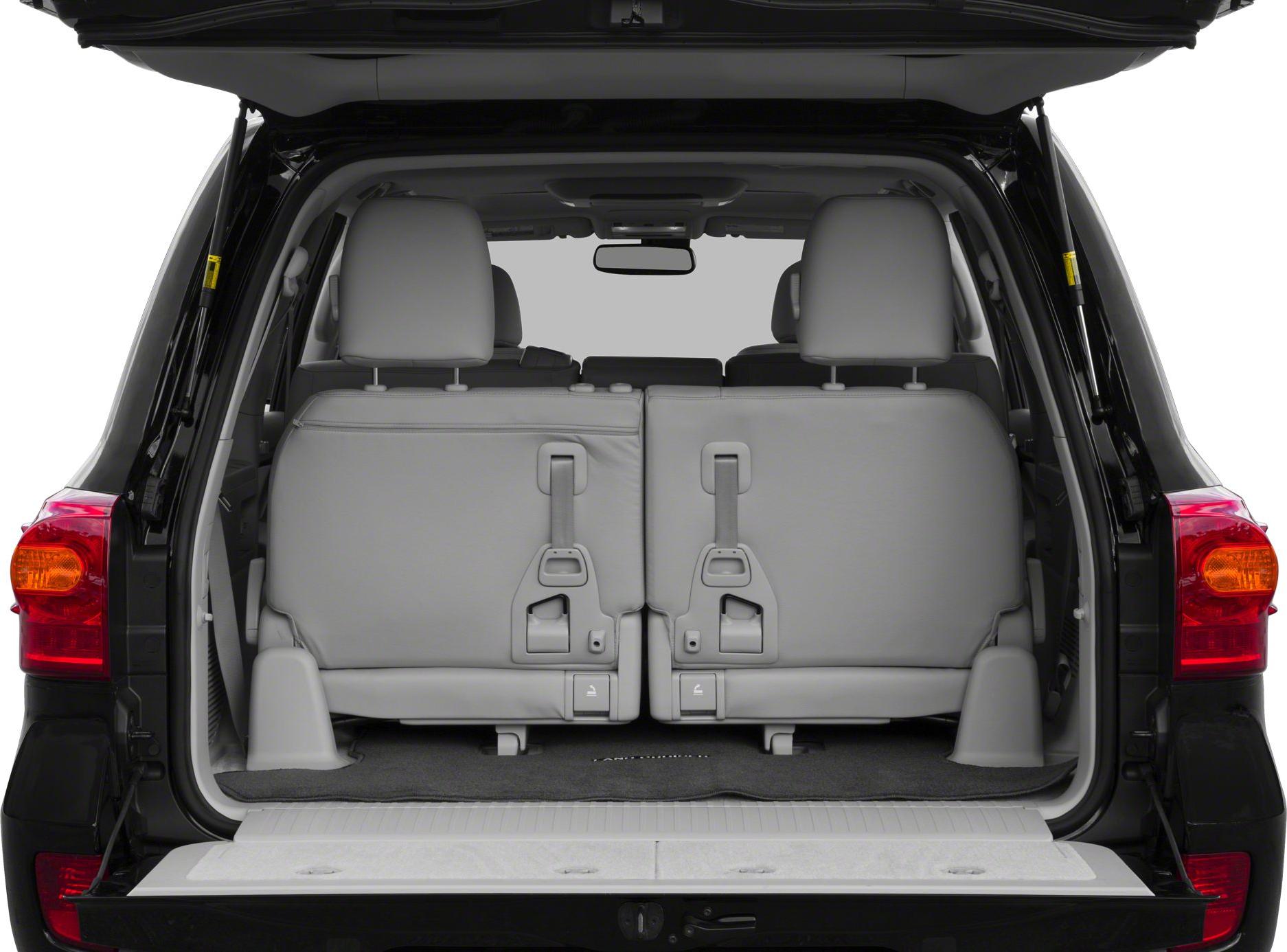 Rear cargo with folded third row seating and open tailgate