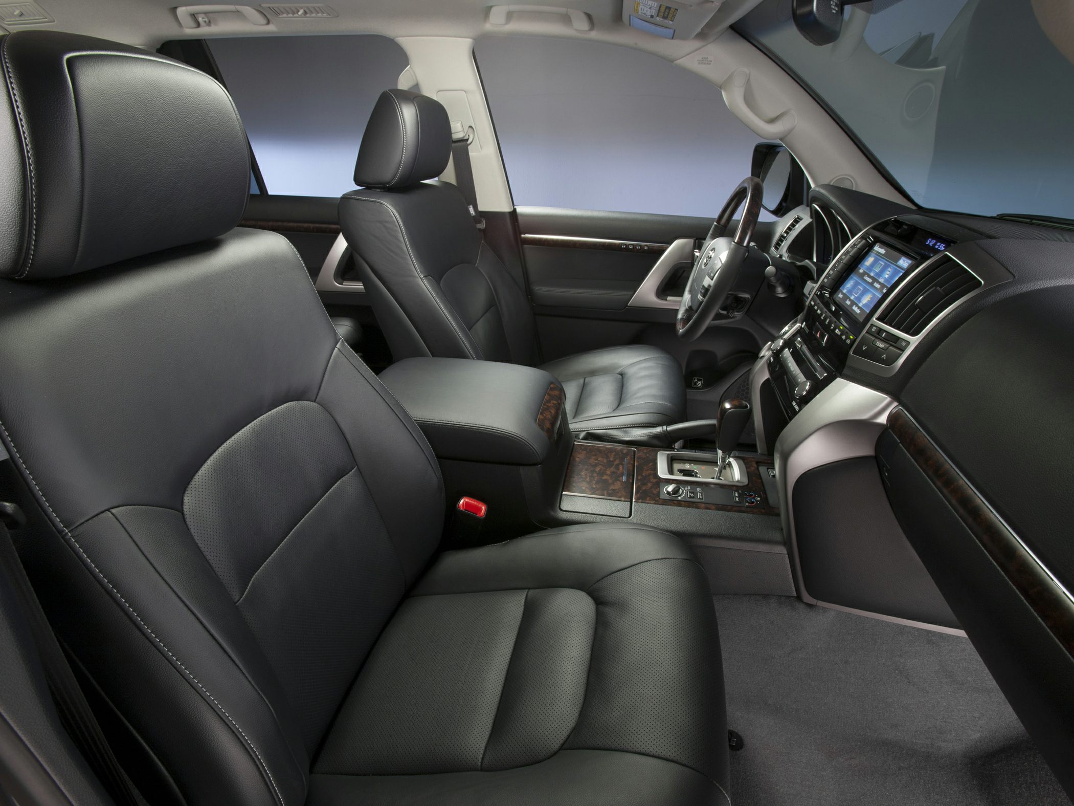 Luxury black leather seats and advanced dashboard with wood trim