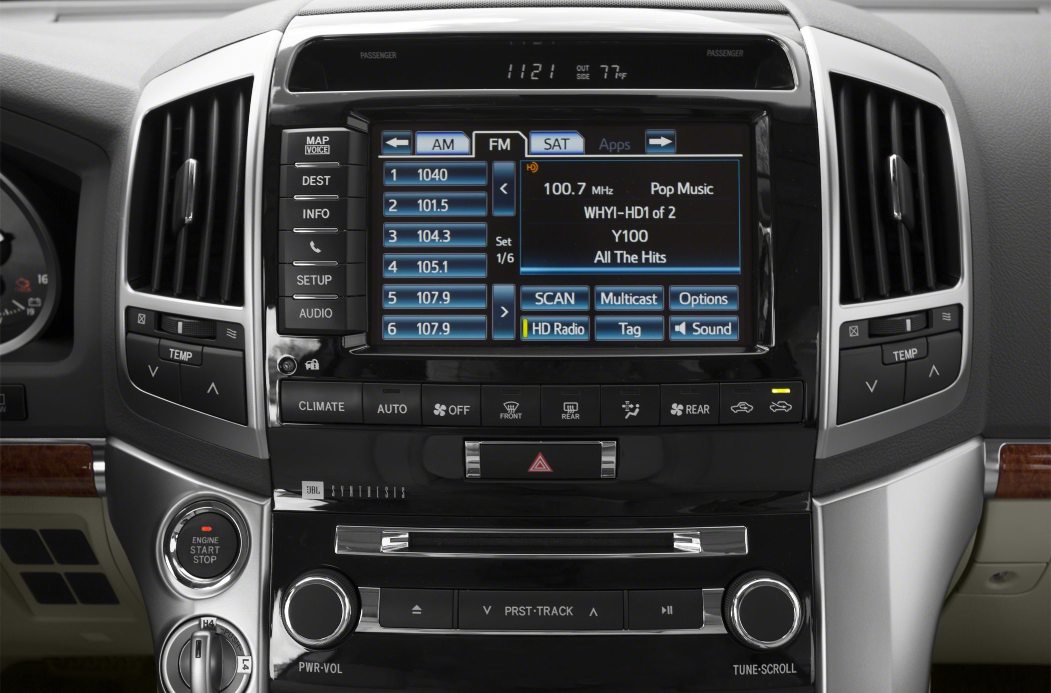 Infotainment screen, climate control buttons, and engine start-stop switch.
