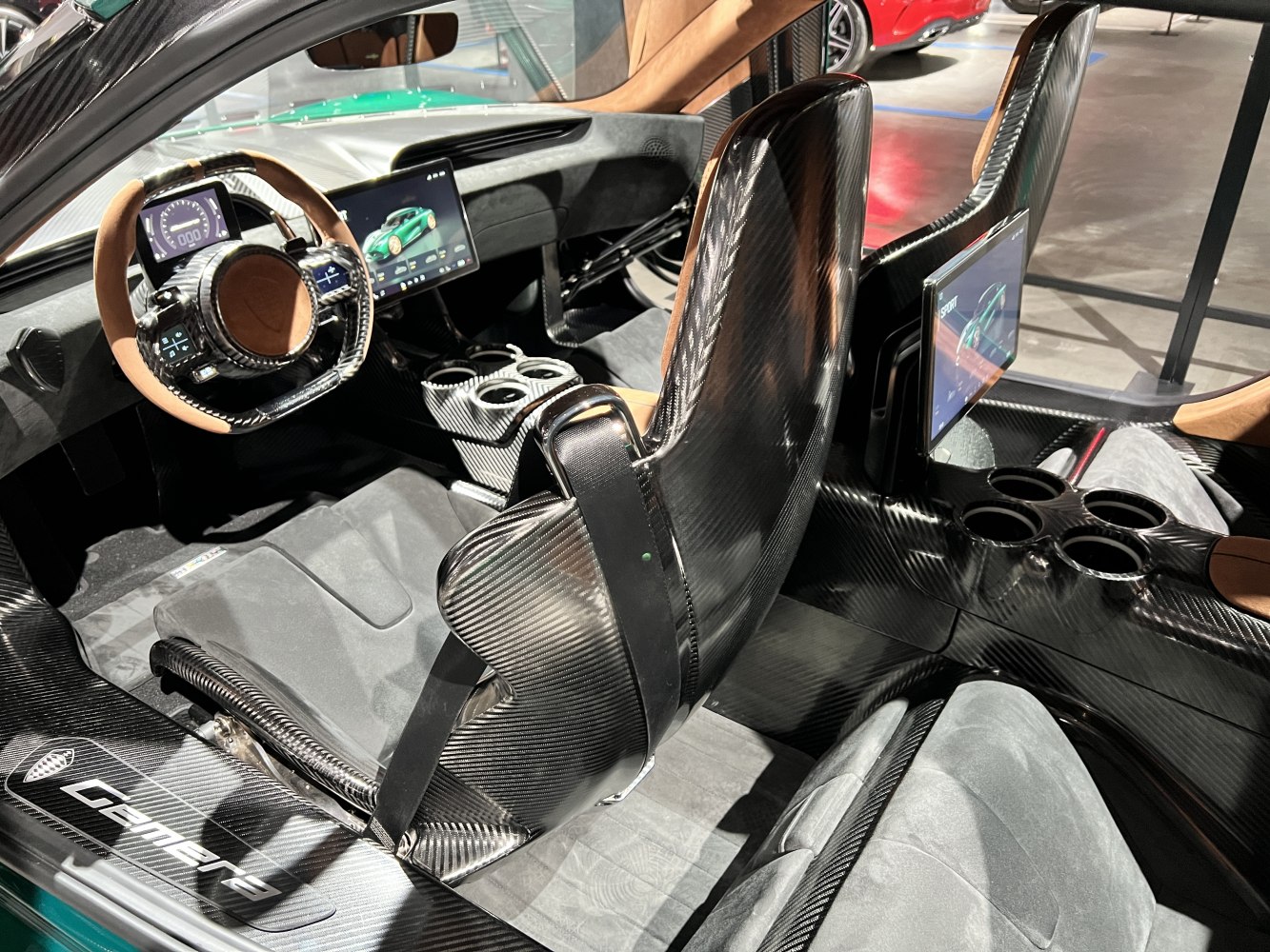Carbon fiber seats and digital dashboard displays in luxury car interior