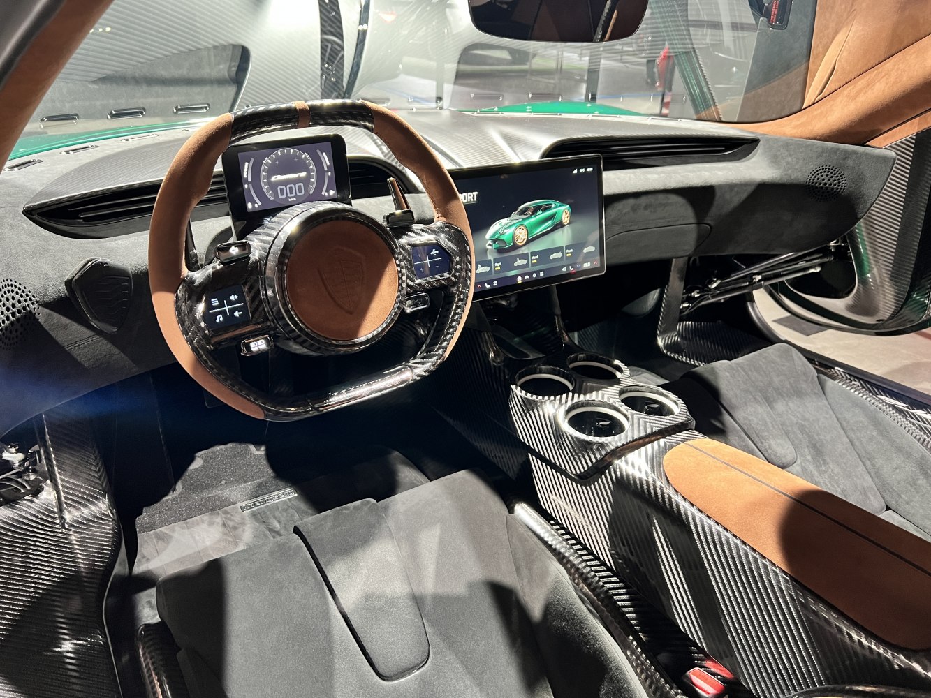 Carbon fiber steering wheel, digital dashboard, large touchscreen center console