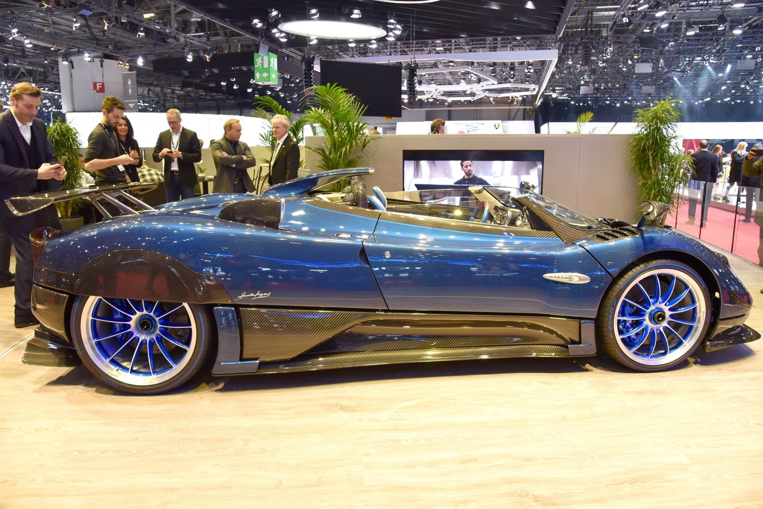 High-performance convertible with carbon fiber body and blue alloy wheels