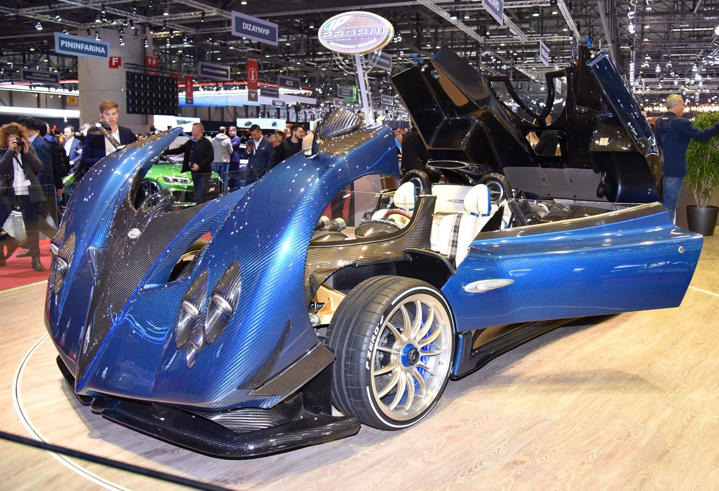 Blue carbon fiber body with upward-opening scissor doors