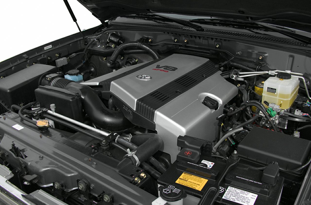 V8 engine bay with clean layout and maintenance free battery.