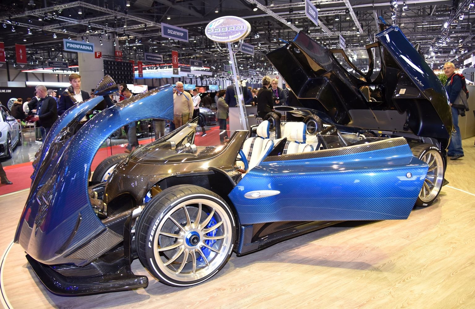 Carbon fiber body with scissor doors in a luxury roadster