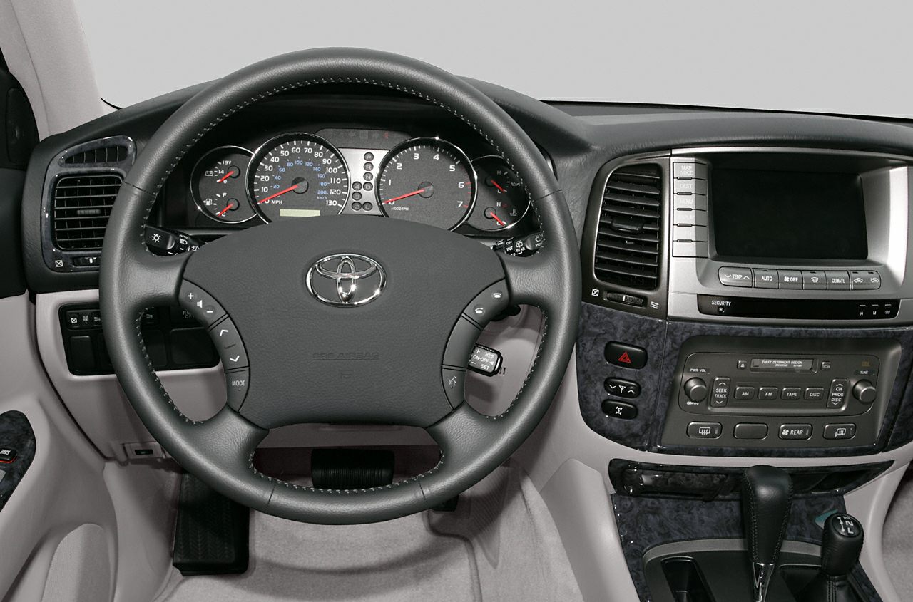 Dashboard and steering wheel with controls in SUV interior