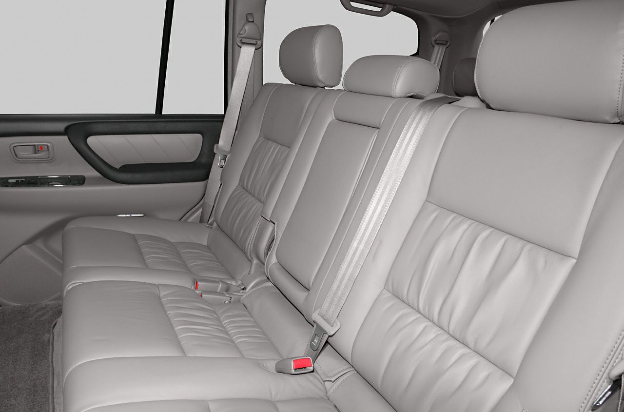 Plush rear leather seats with headrests and seat belts