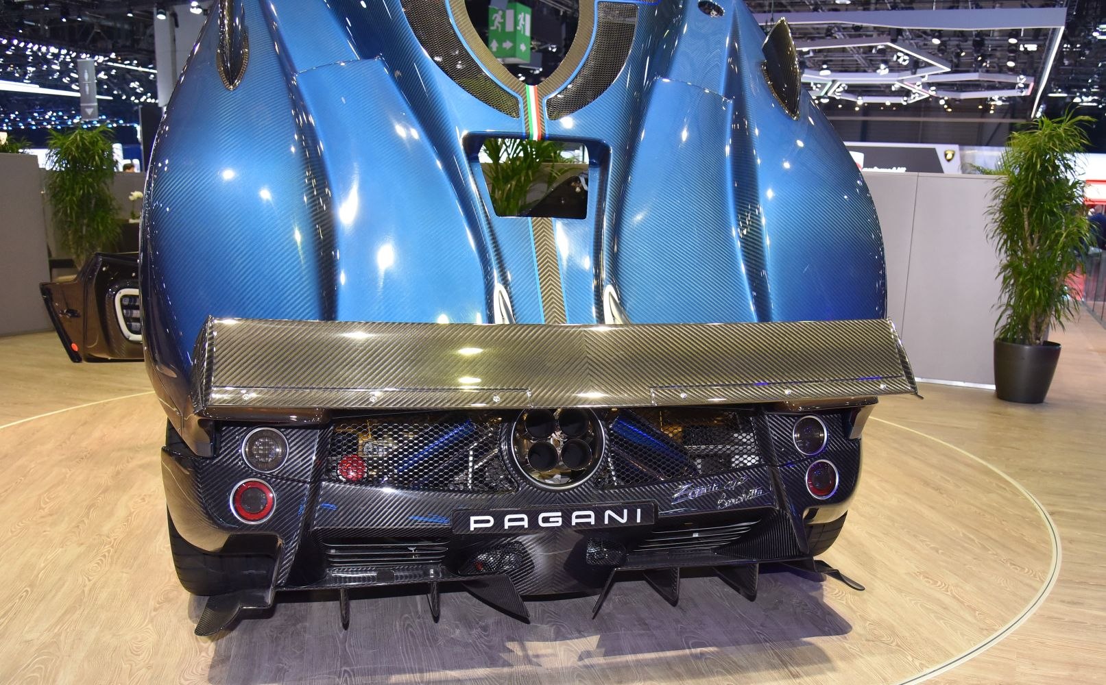 Triple exhaust outlets and large carbon fiber rear wing.
