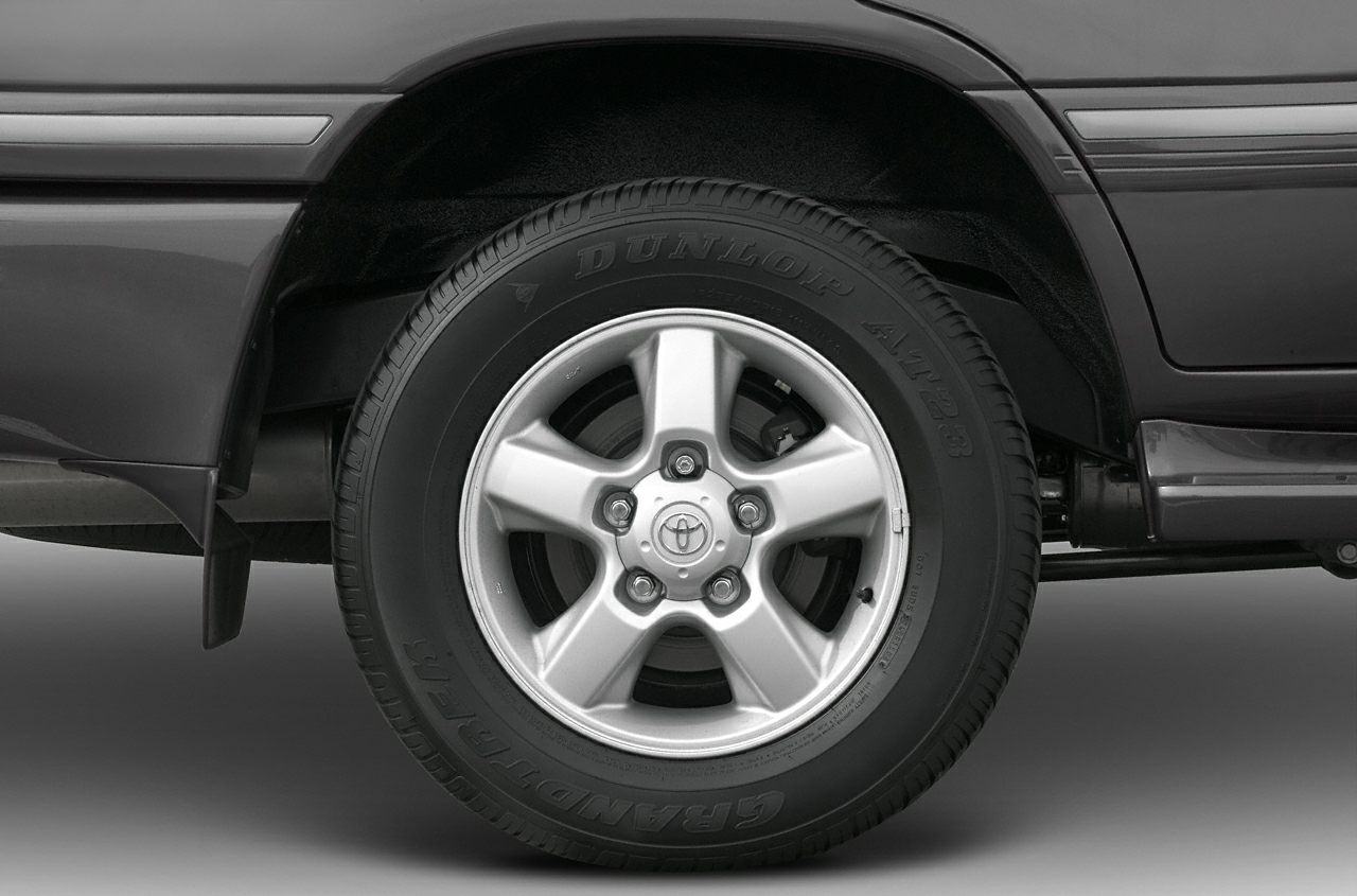 Alloy wheel with Dunlop AT23 tire on SUV