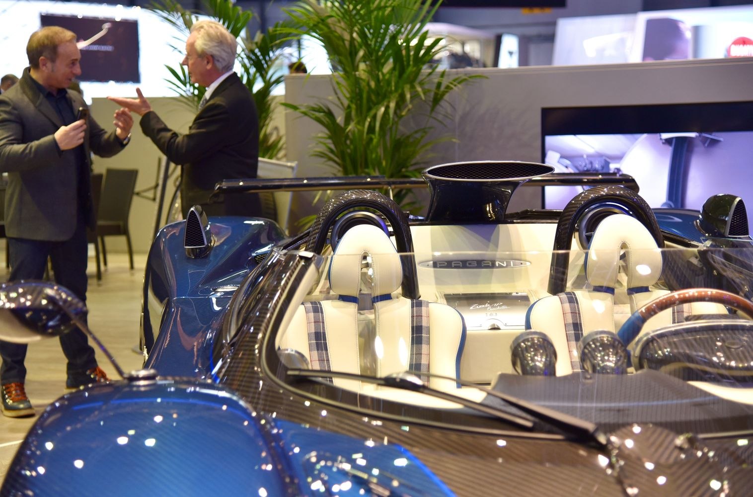 Open-top cockpit with white leather and carbon fiber detailing
