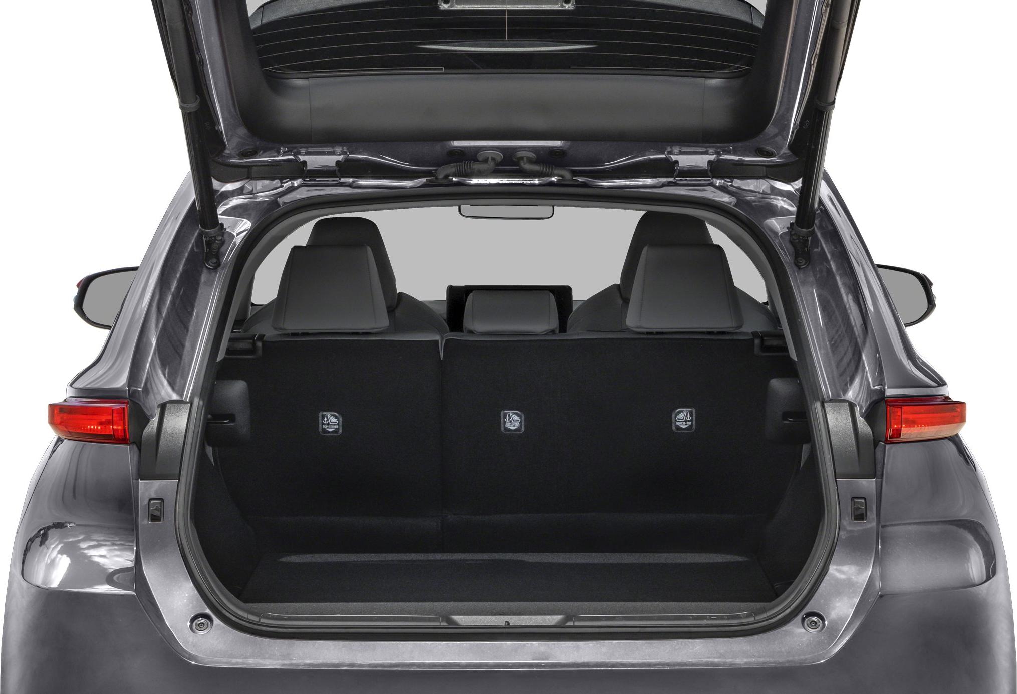 Open rear hatch with visible trunk space and rear seats.