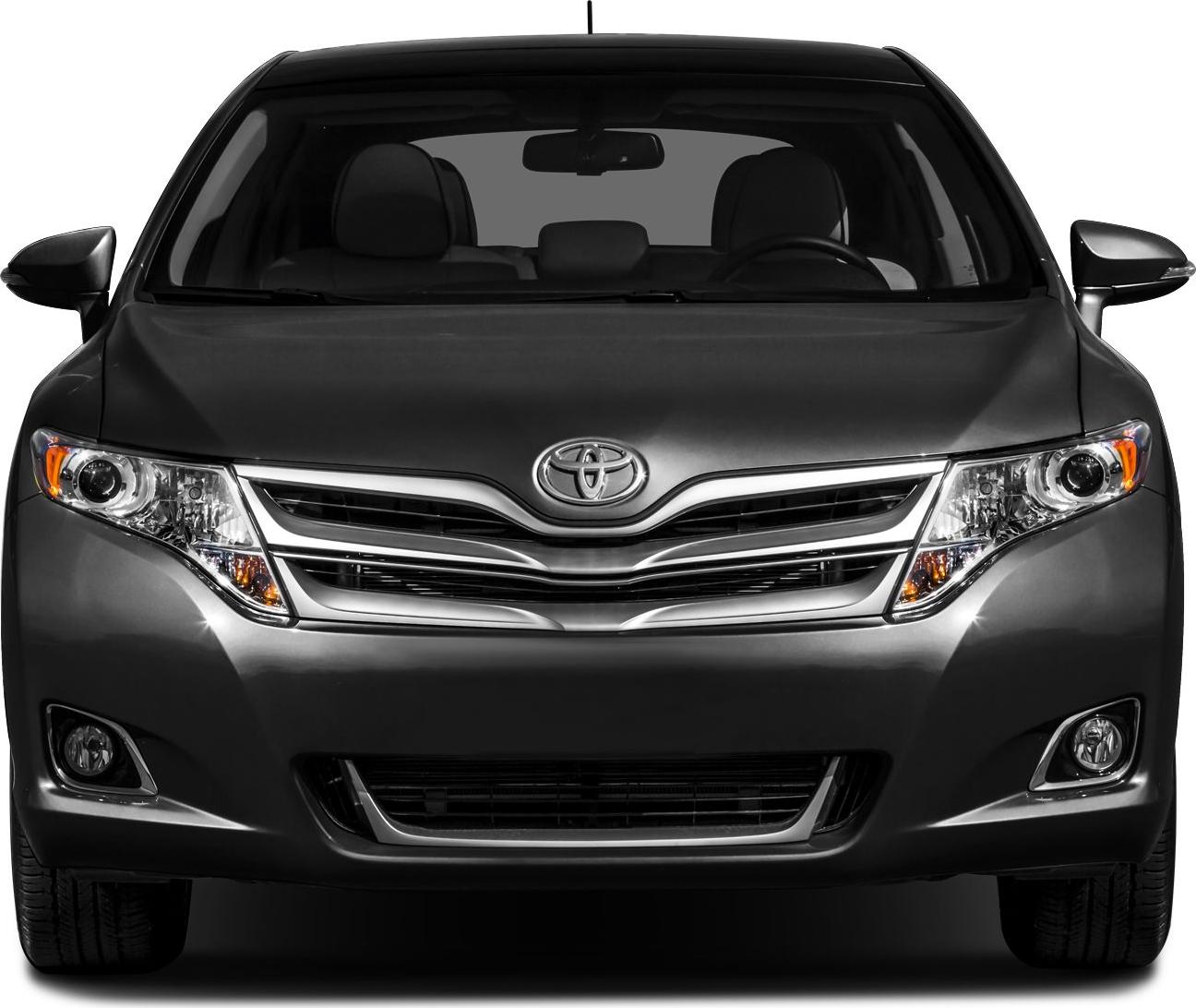 Front view showcasing headlights, chrome grille, and fog lights