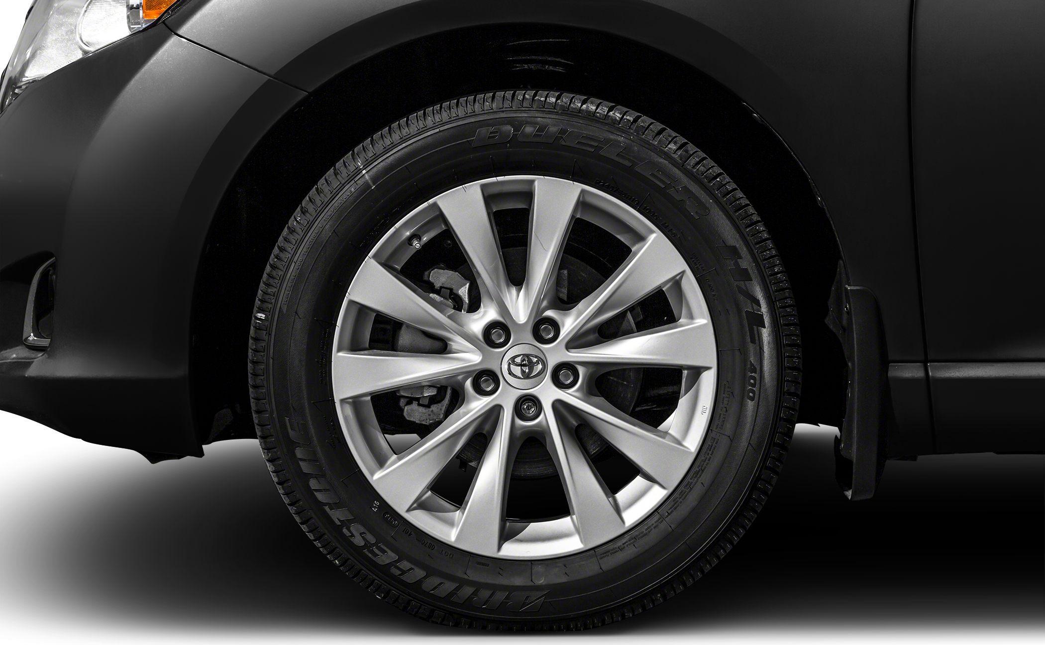 Close-up of alloy wheel and tire on car front side