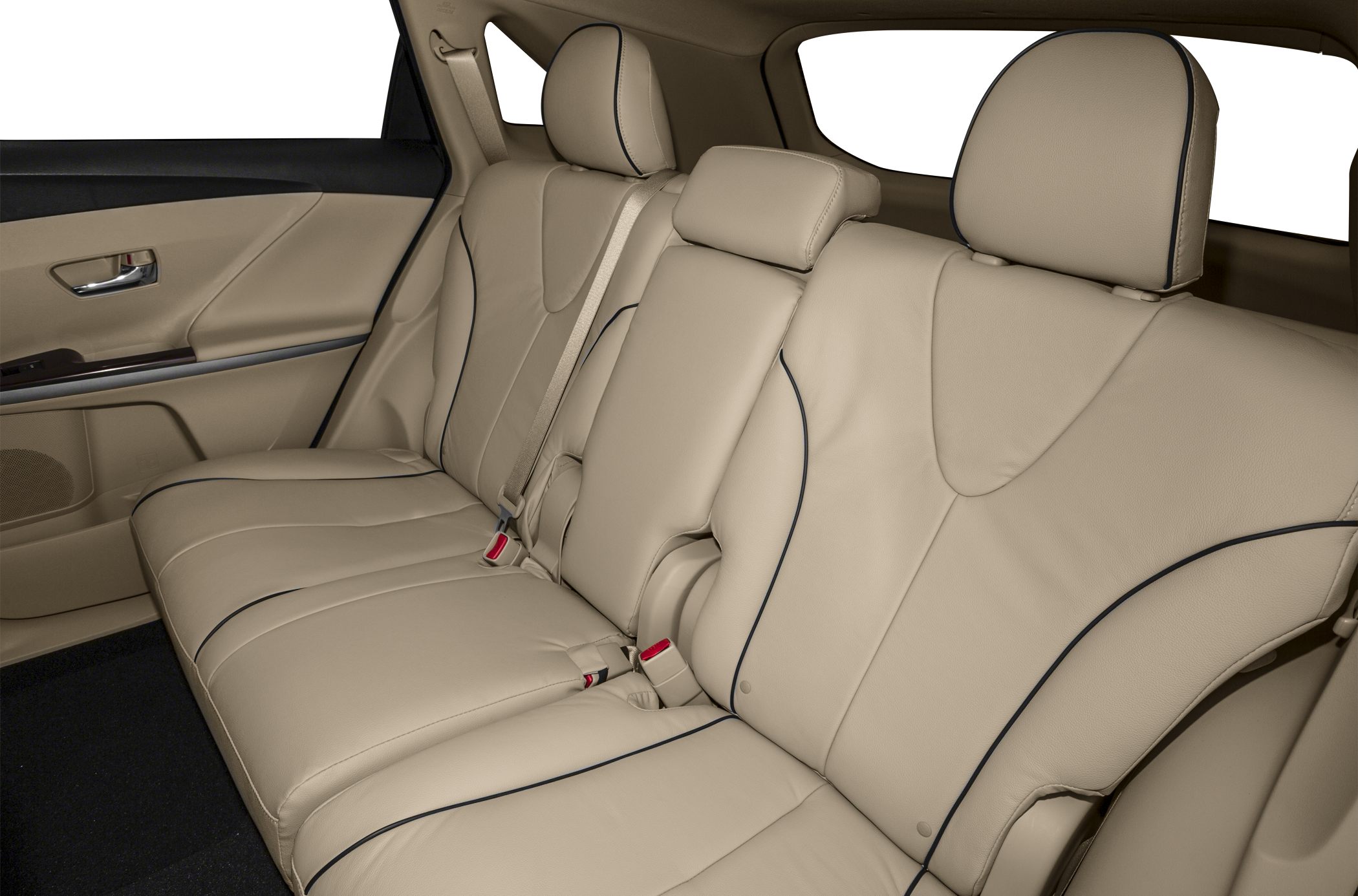 Beige leather rear seat with black piping and adjustable headrests