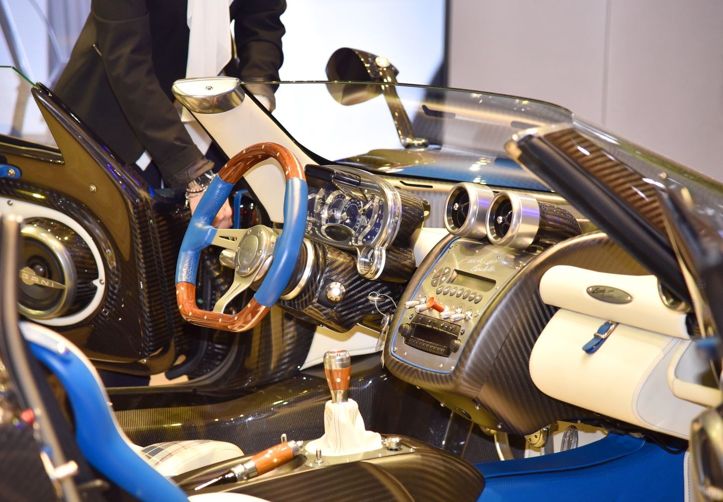 Luxury carbon fiber dashboard and wood-accented steering wheel interior