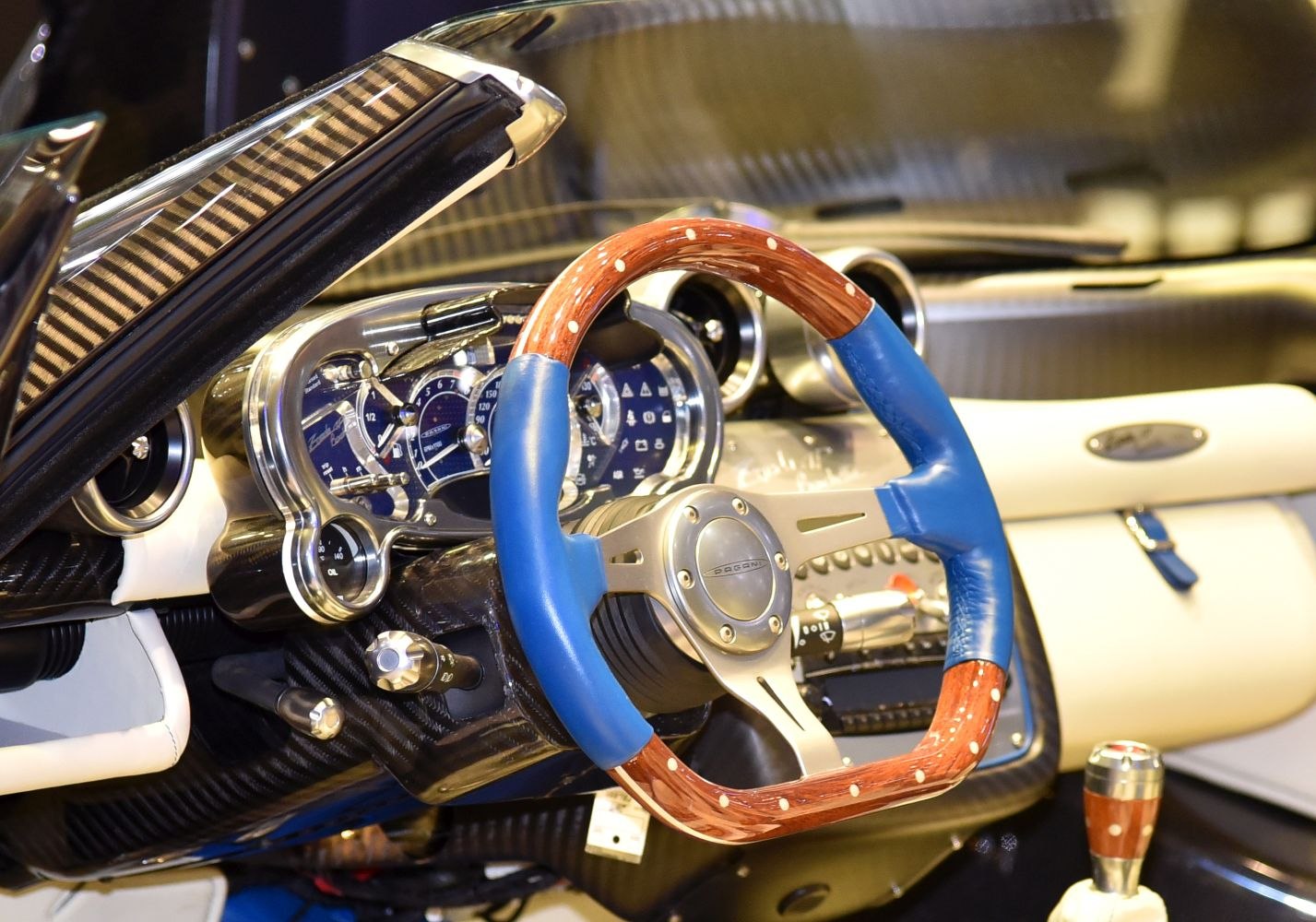 Wooden and leather steering wheel with carbon fiber dashboard