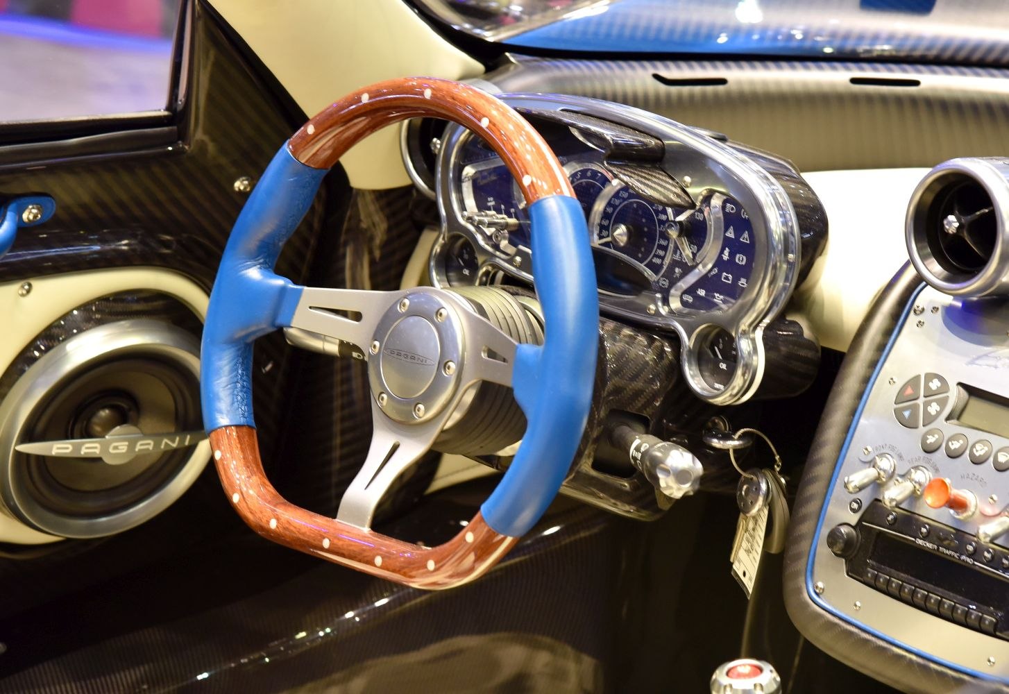 Blue and wood steering wheel with carbon fiber dashboard