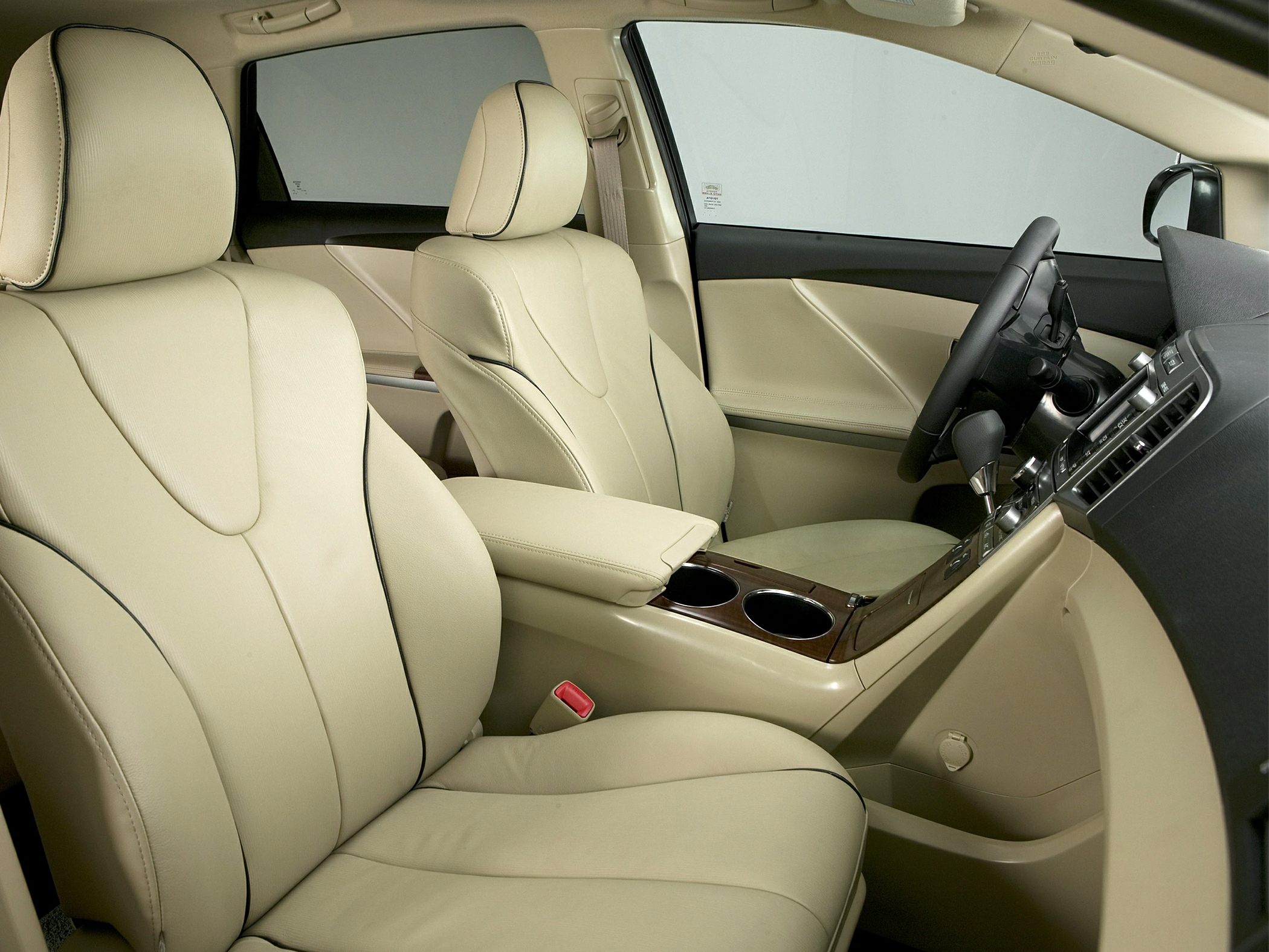 Beige leather seats with wood trim center console and cup holders