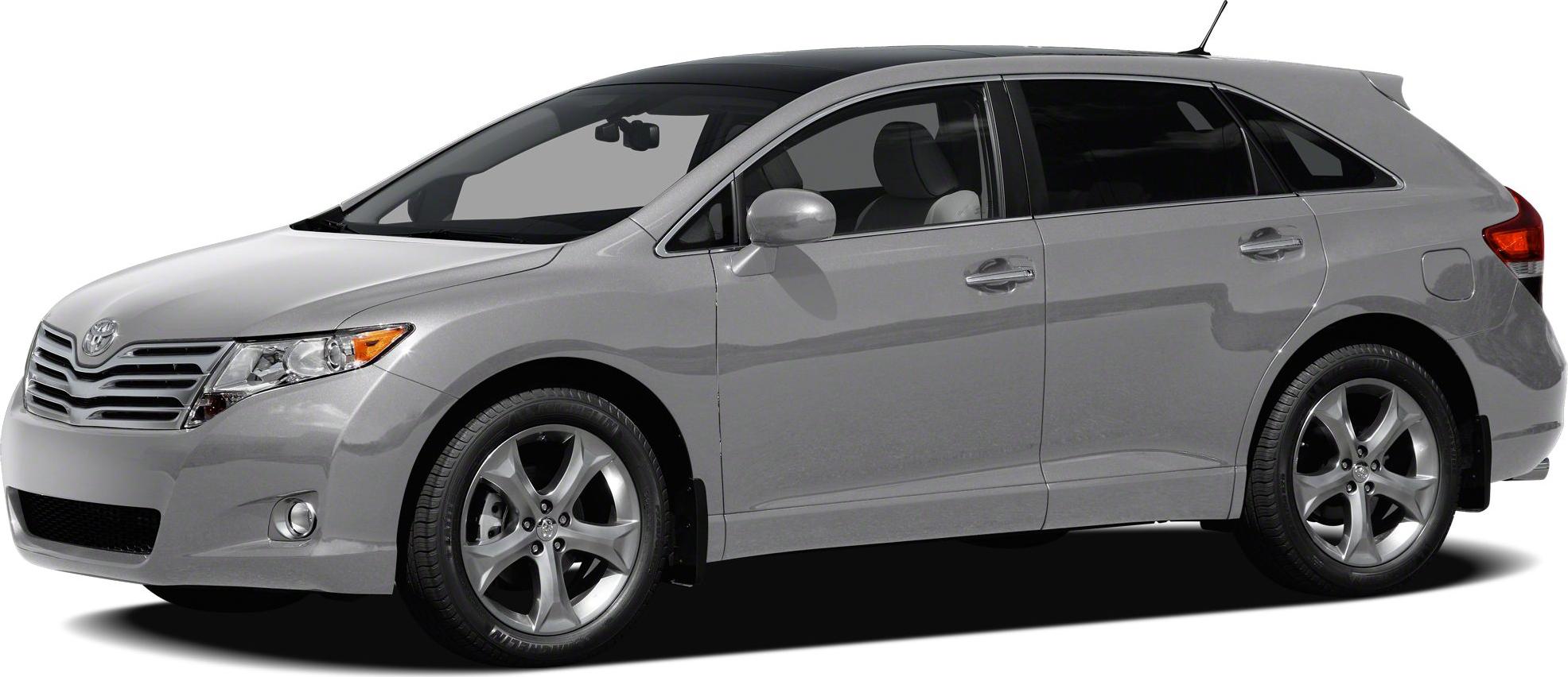 Side profile of a gray vehicle with alloy wheels and five-door design