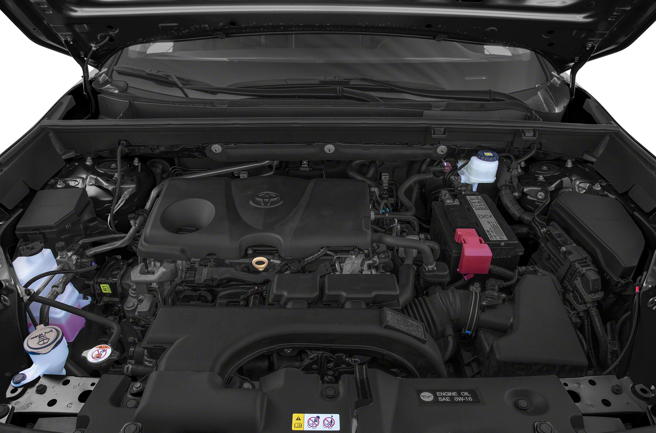 Close-up of a modern engine bay with Toyota logo on engine cover.
