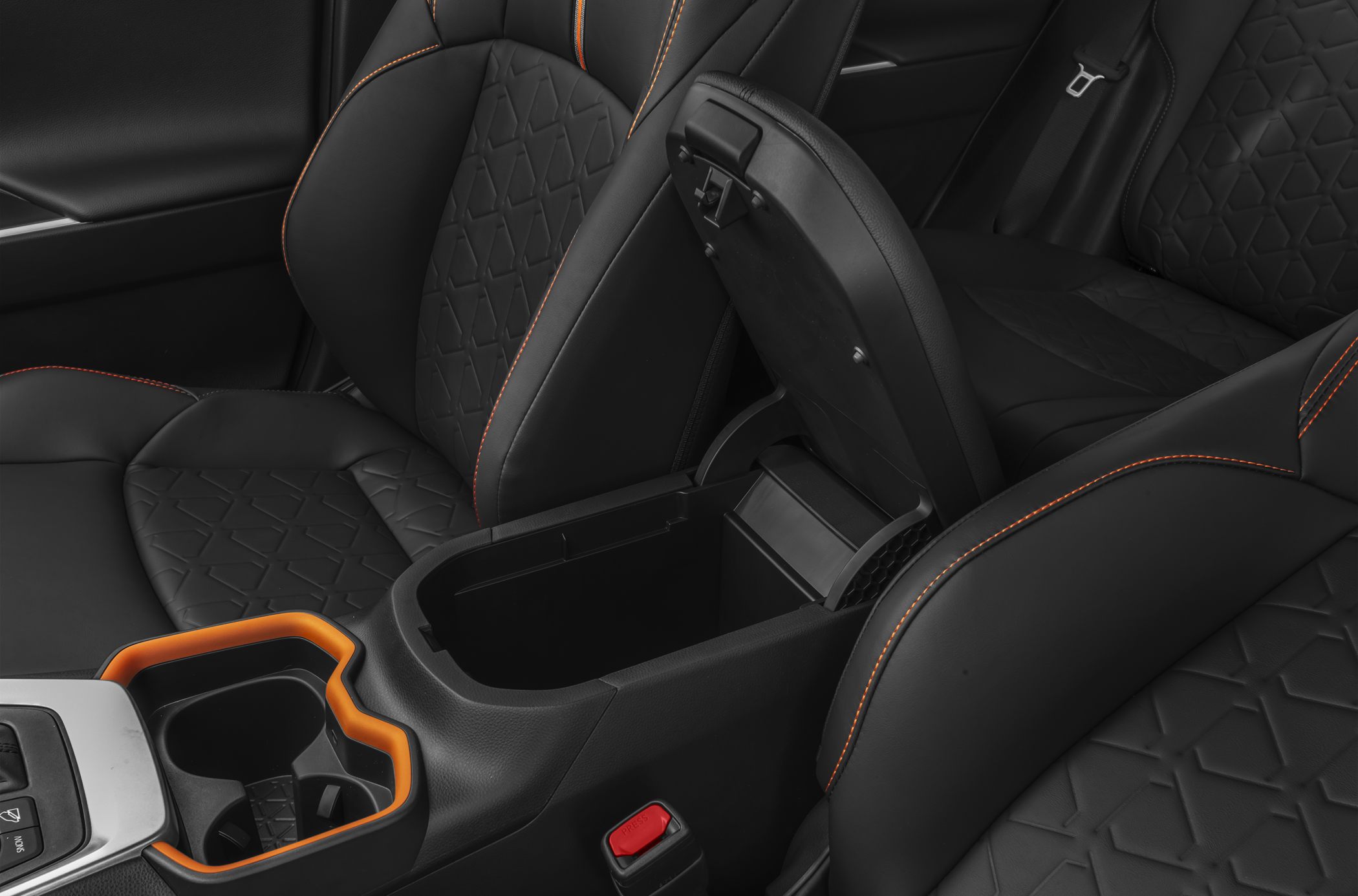 Black leather seats with orange stitching and open center console storage