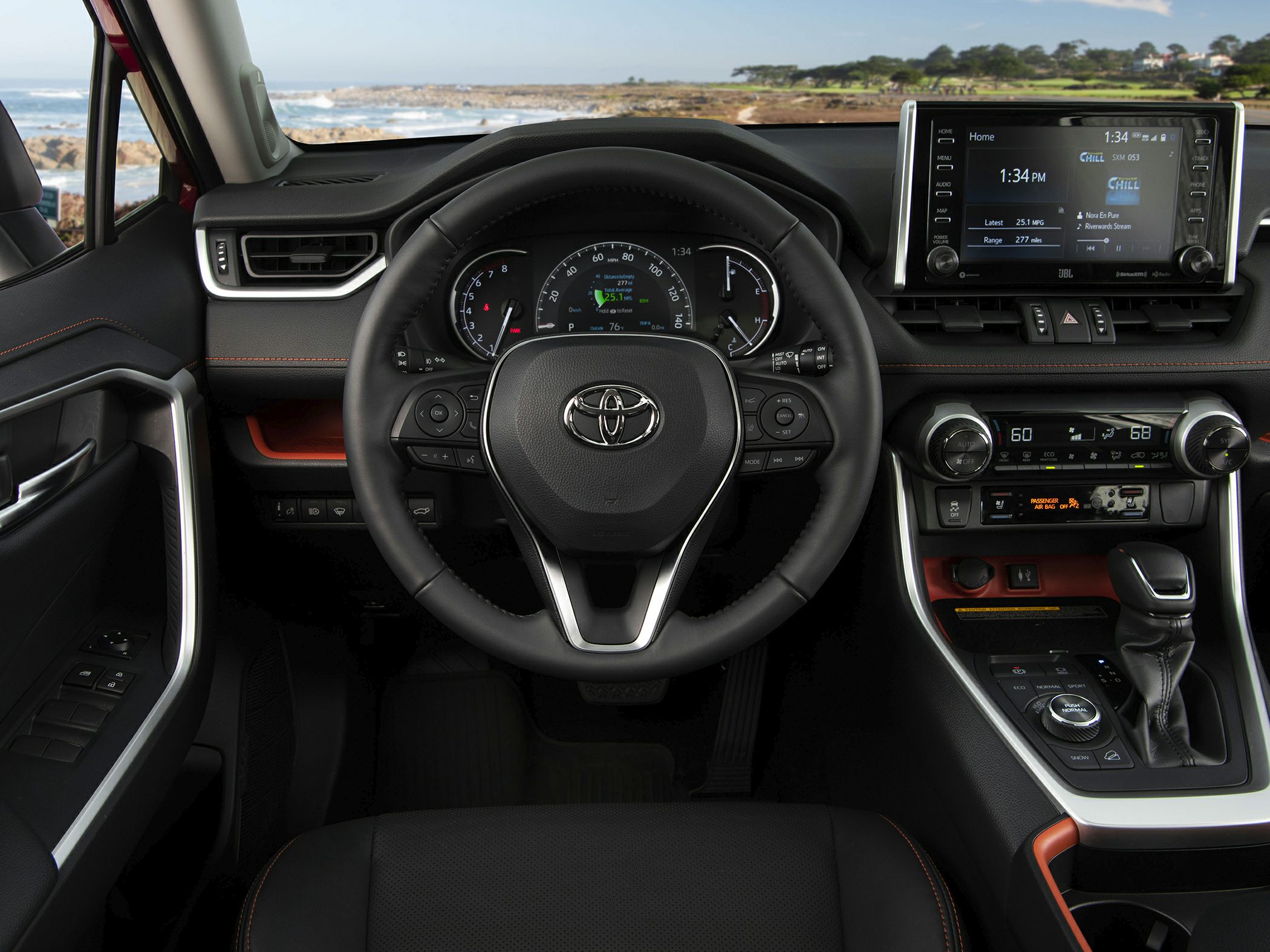 Car interior dashboard with steering wheel and infotainment screen