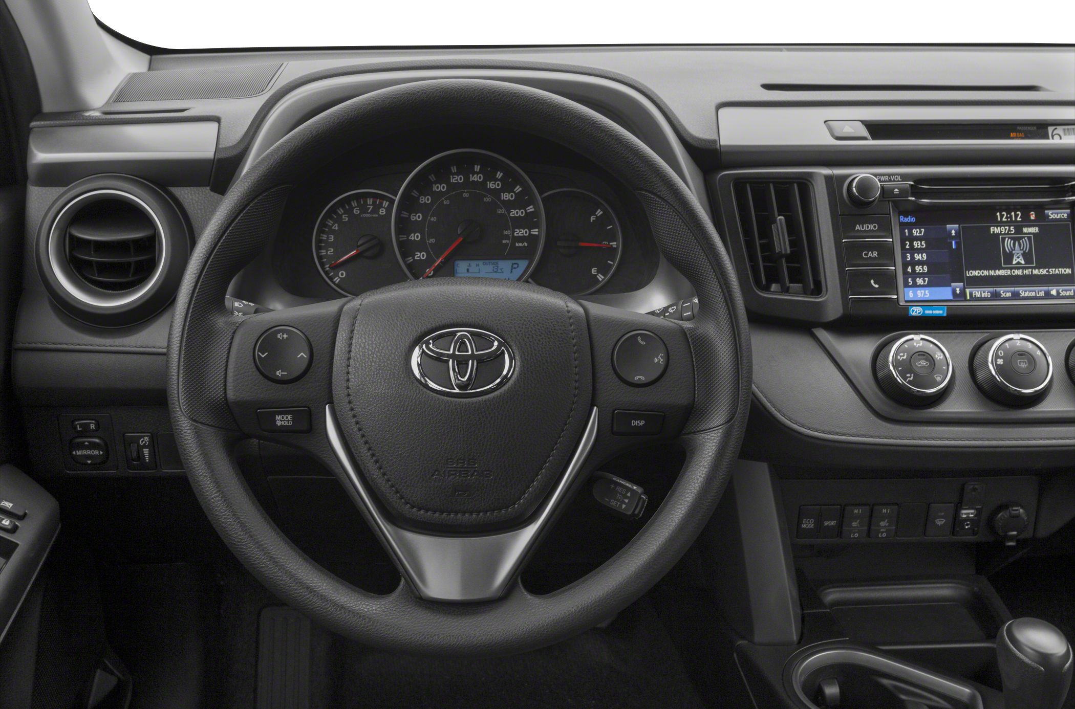 Steering wheel with controls, dashboard gauges, infotainment screen, and climate control knobs.