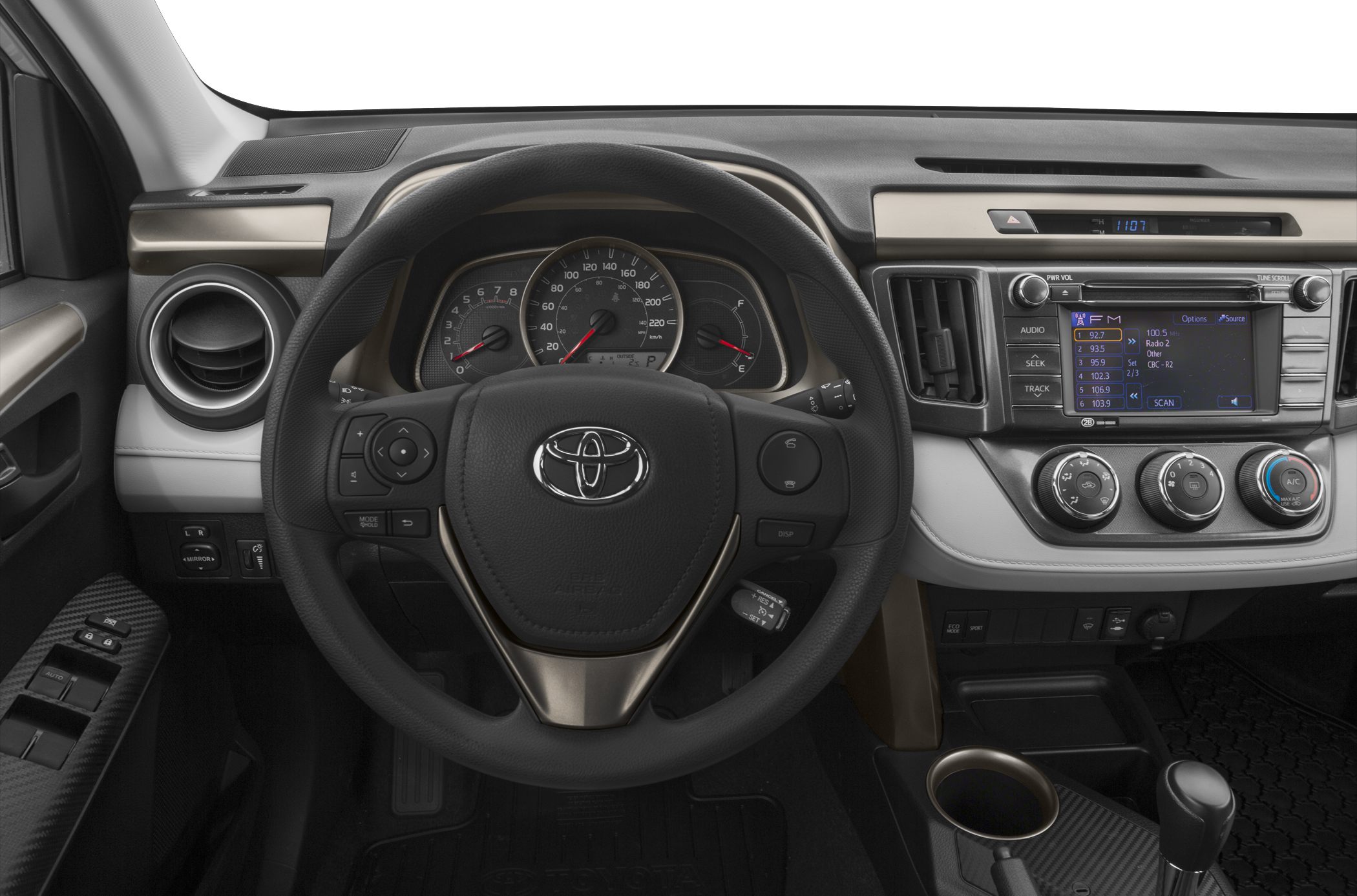 Steering wheel, dashboard gauges, infotainment screen, climate control knobs