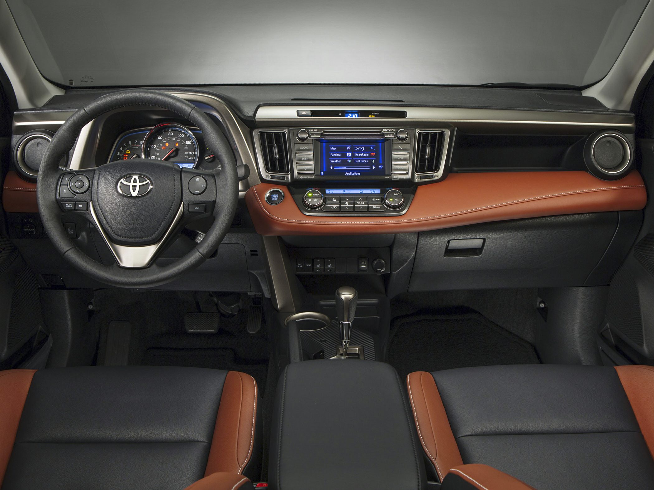 Modern SUV dashboard with multimedia display and leather steering wheel