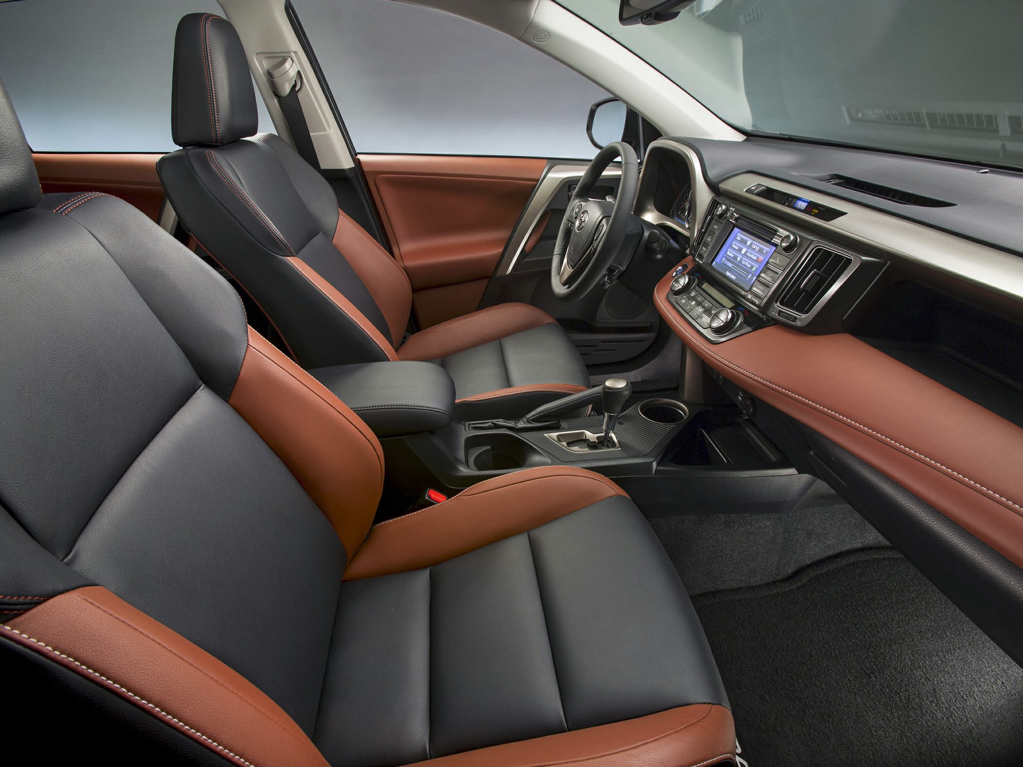 Two-tone leather seats and modern dashboard with infotainment system