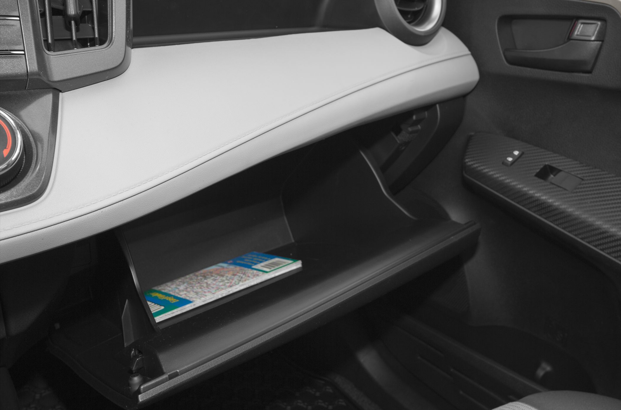 Open glovebox with dashboard and door panel details