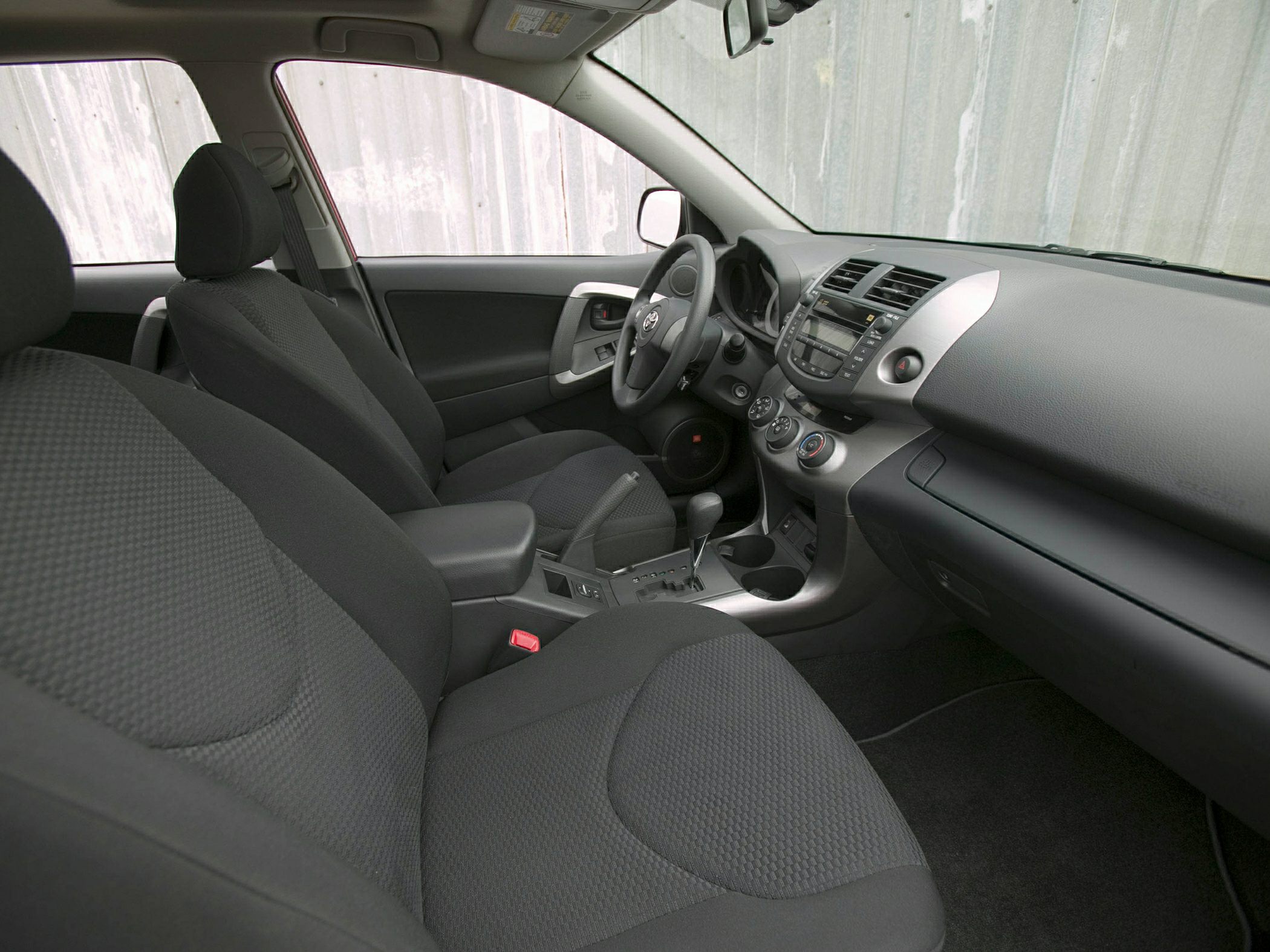 Front seats and dashboard interior view with center console