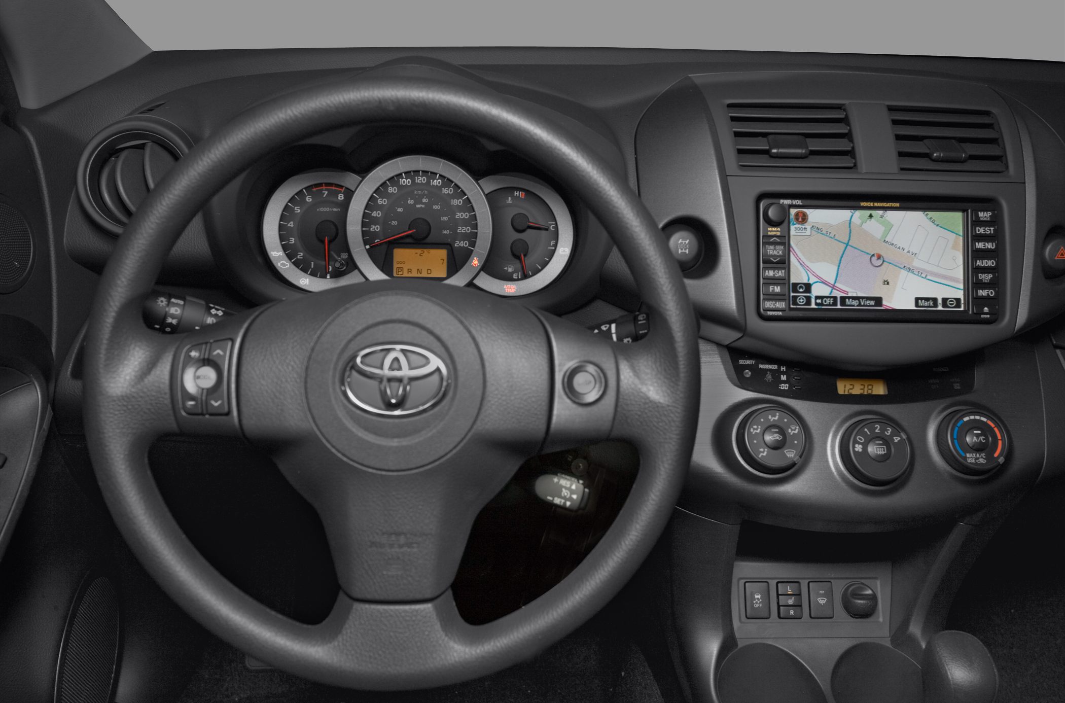 Dashboard with instrument cluster, steering wheel, and navigation system.