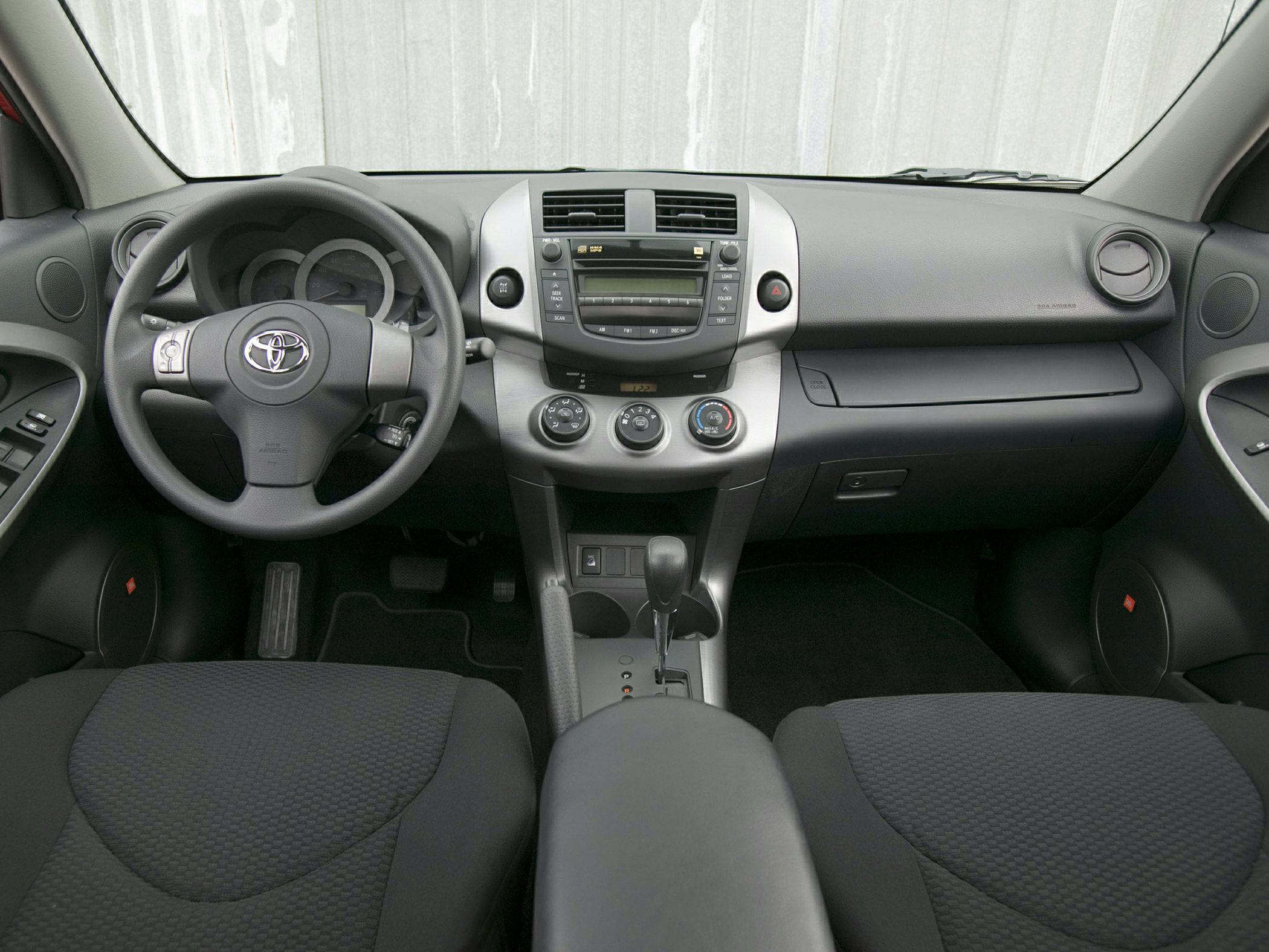 Dashboard, steering wheel, center console, automatic gear shifter, climate controls