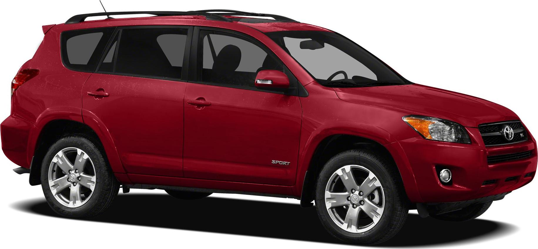 Side view of red mid-size SUV with roof rails and alloy wheels
