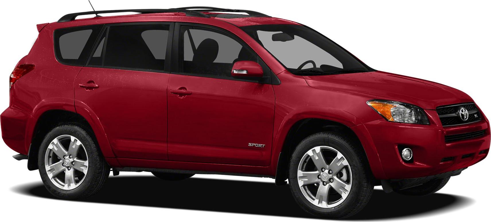 Side profile of red SUV with alloy wheels and roof rails