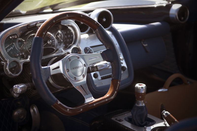 Close-up of steering wheel, dashboard, and gear shifter interior