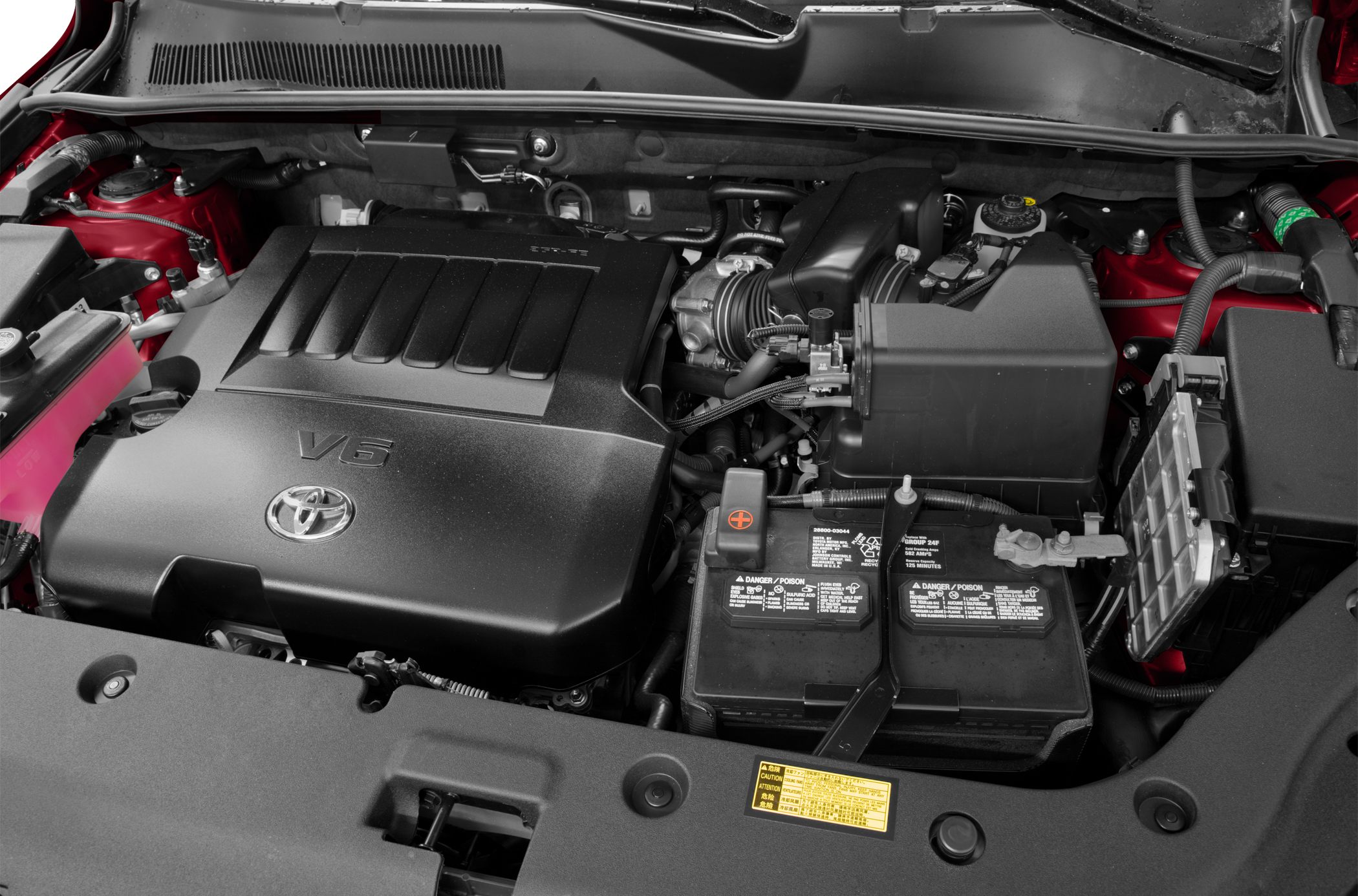 V6 engine cover with battery and air intake system in engine compartment