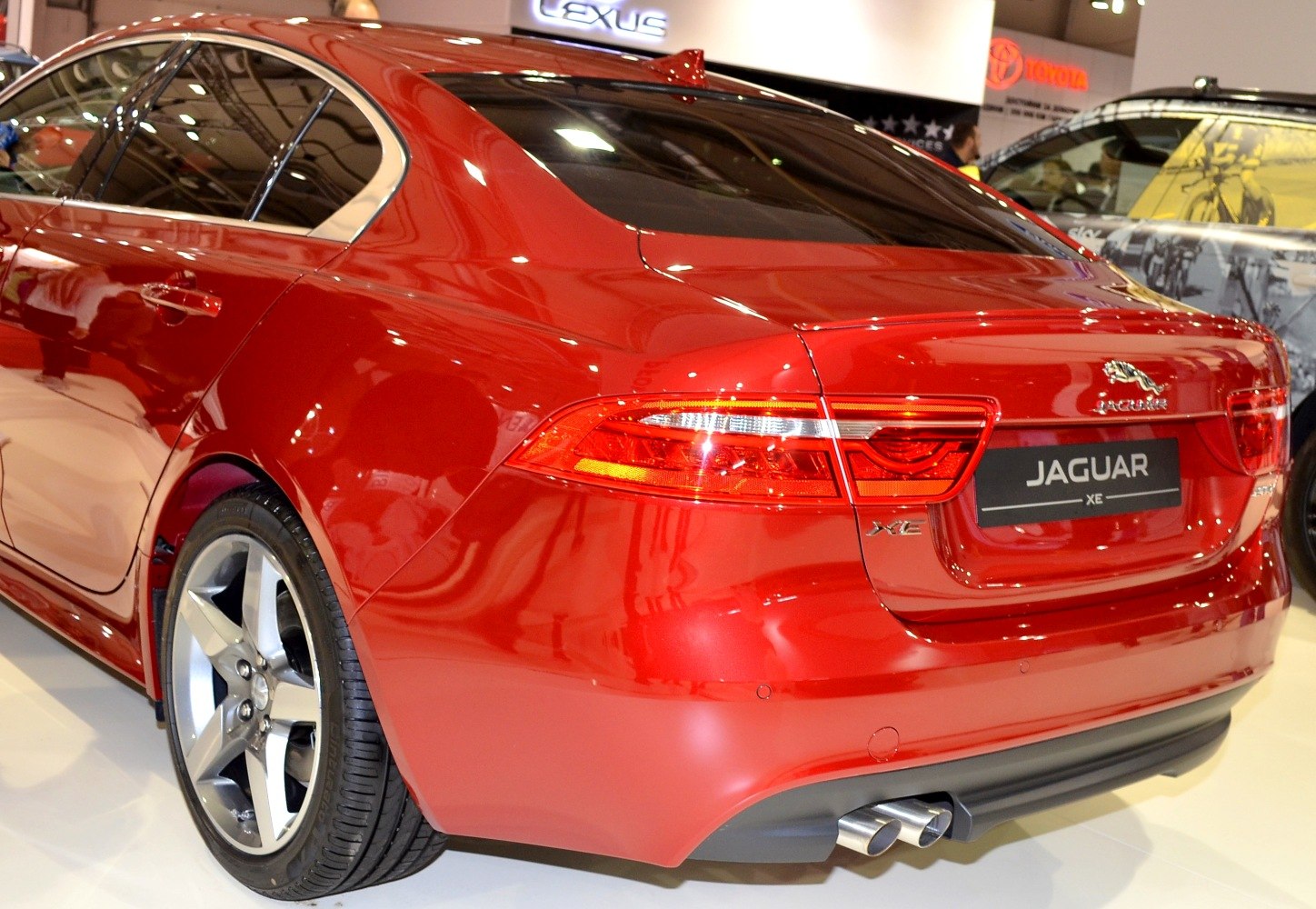 Rear section with taillights, dual exhaust, and alloy wheel