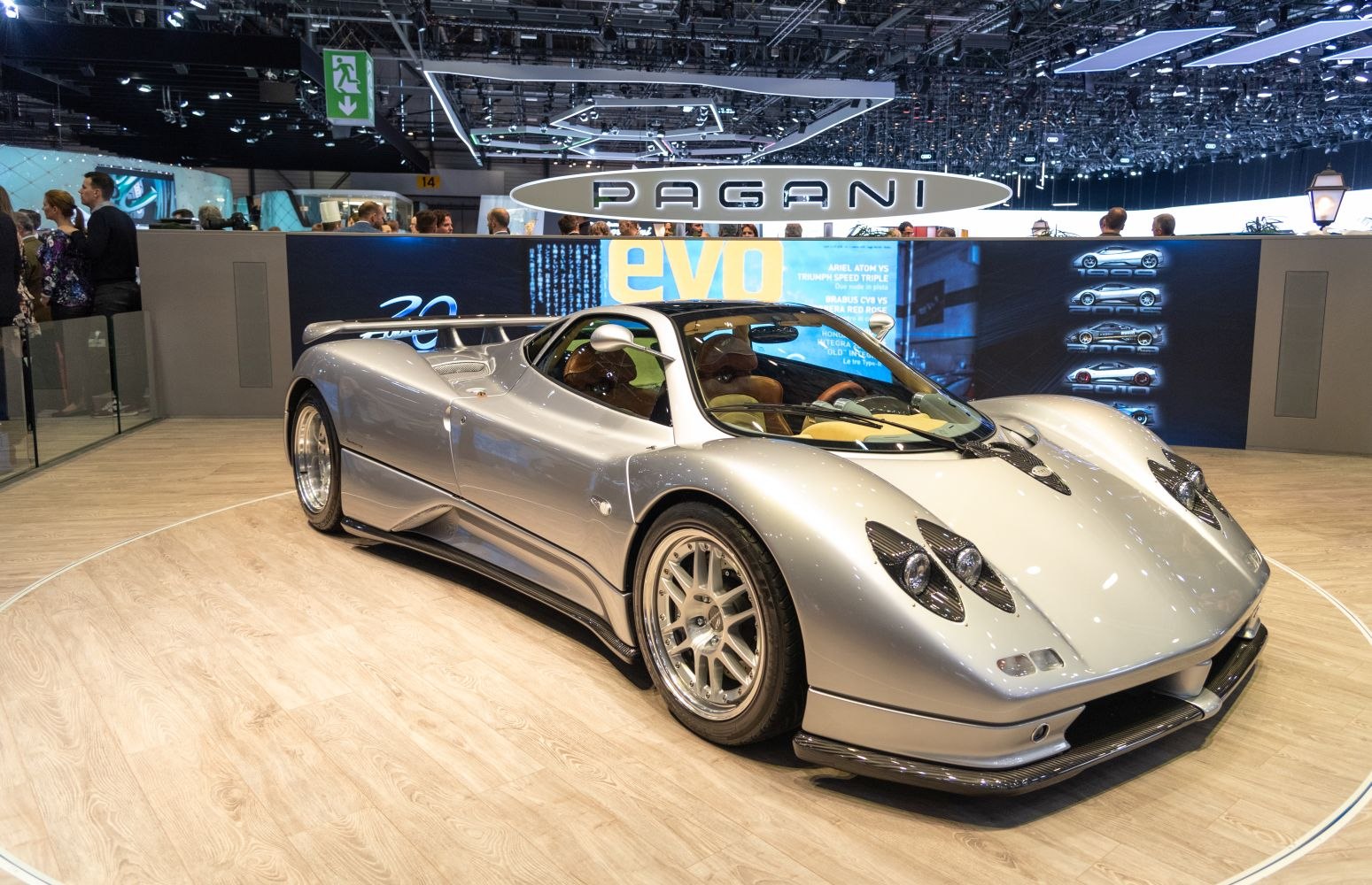 Silver supercar with aerodynamic curves and unique quad headlight clusters
