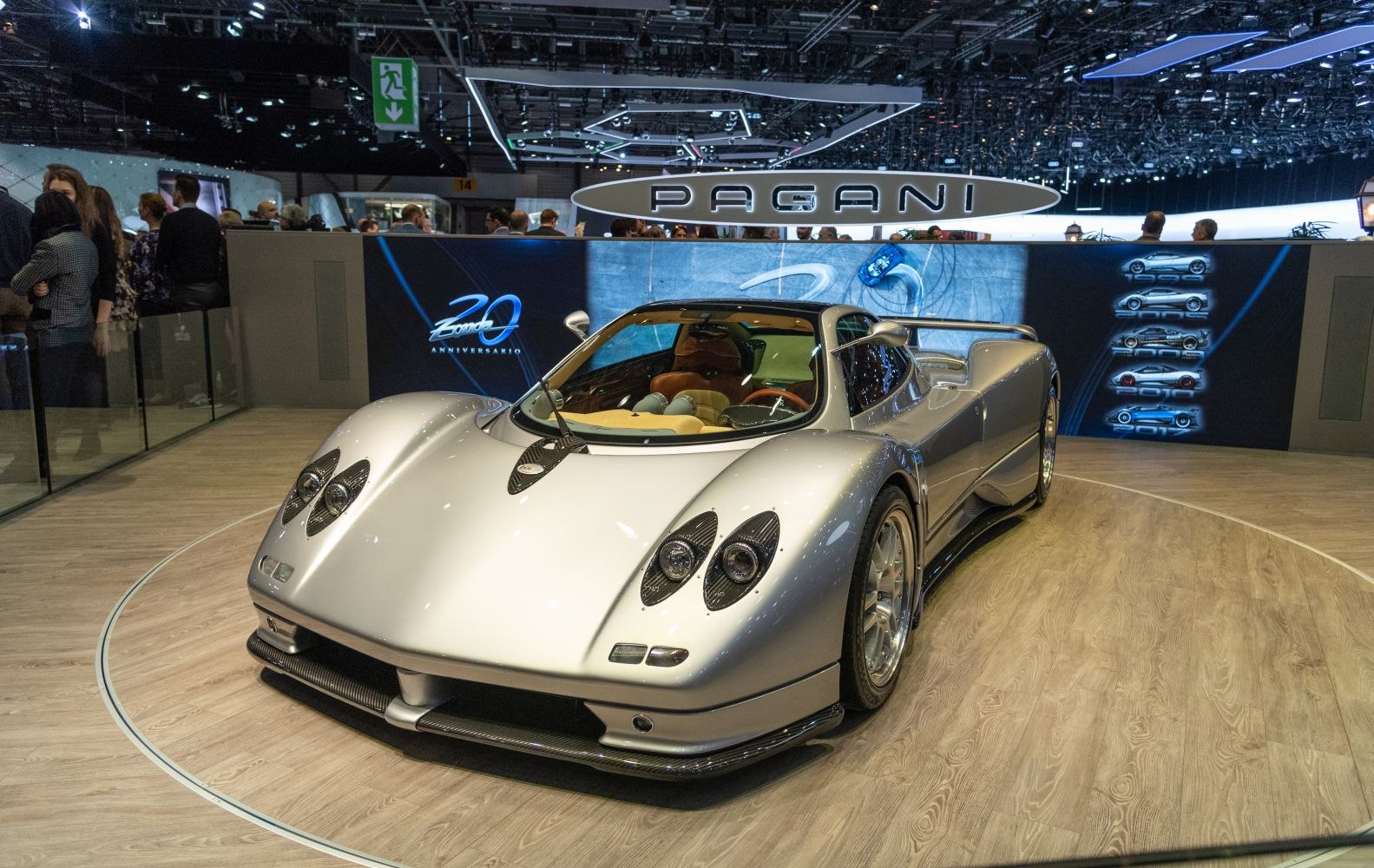 Silver high-performance sports car with distinctive quad headlights and aerodynamic design