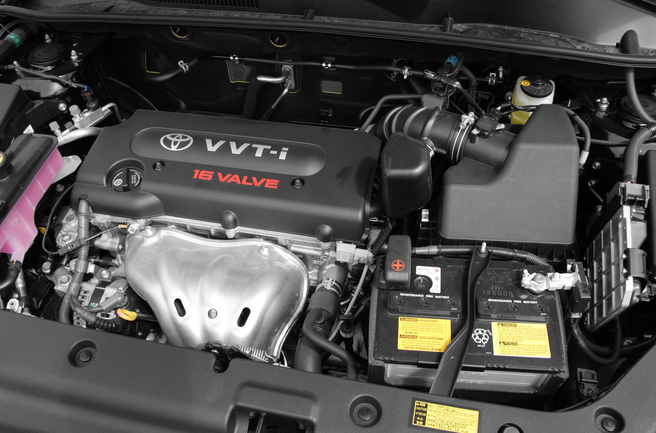 16 valve VVT-i engine layout with battery and air intake system