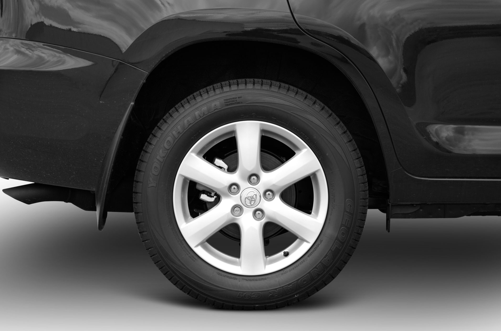 Rear wheel with alloy rim and Yokohama tire closeup
