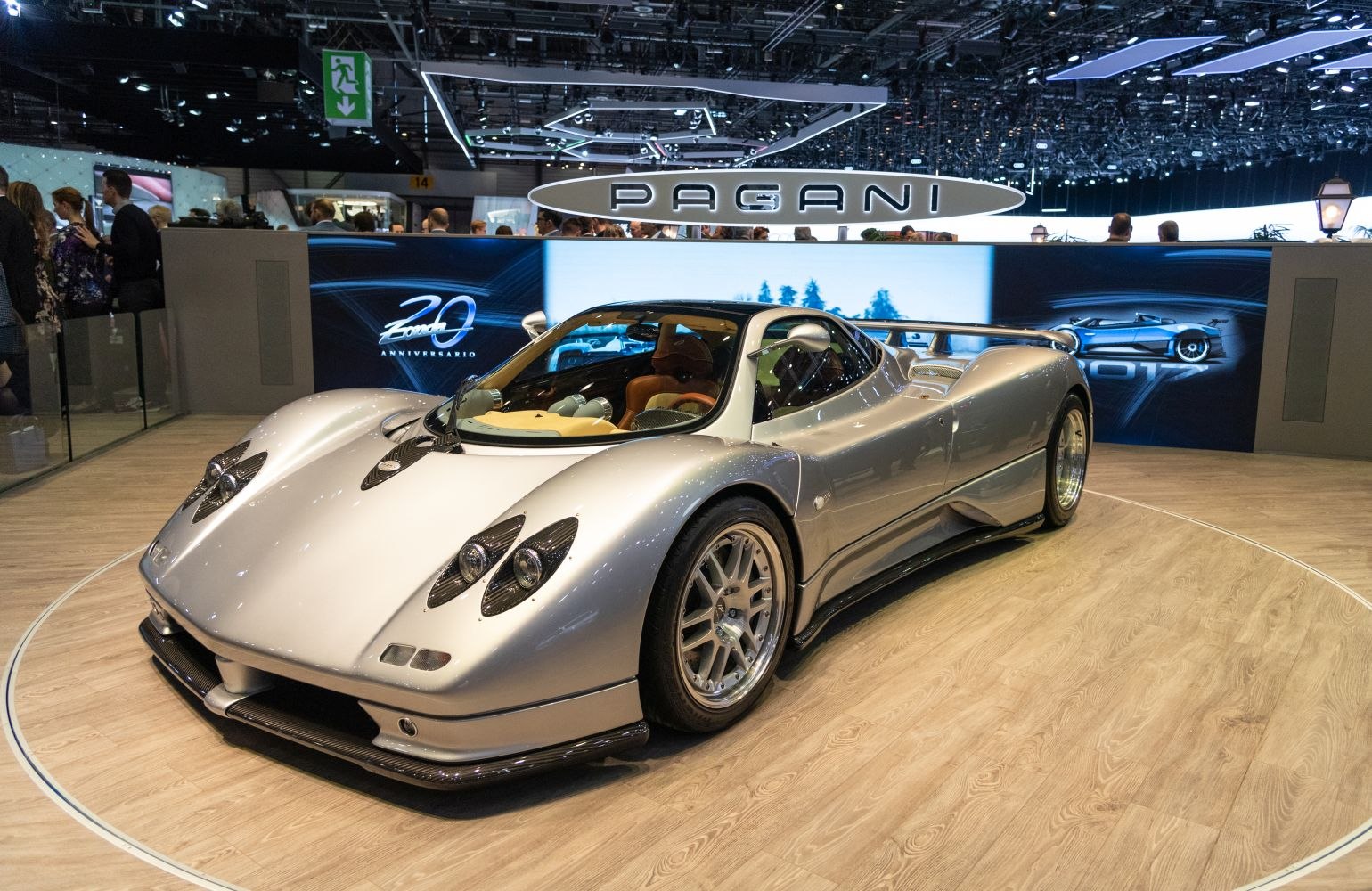 Aerodynamic curved sports coupe with prominent rear wing and sleek headlights