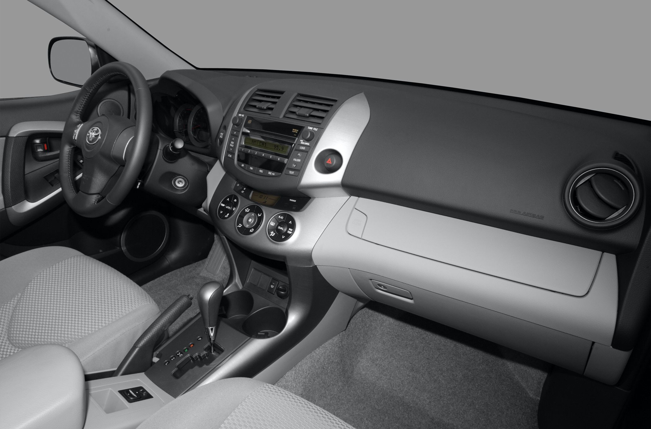 Dashboard and center console with steering wheel and controls