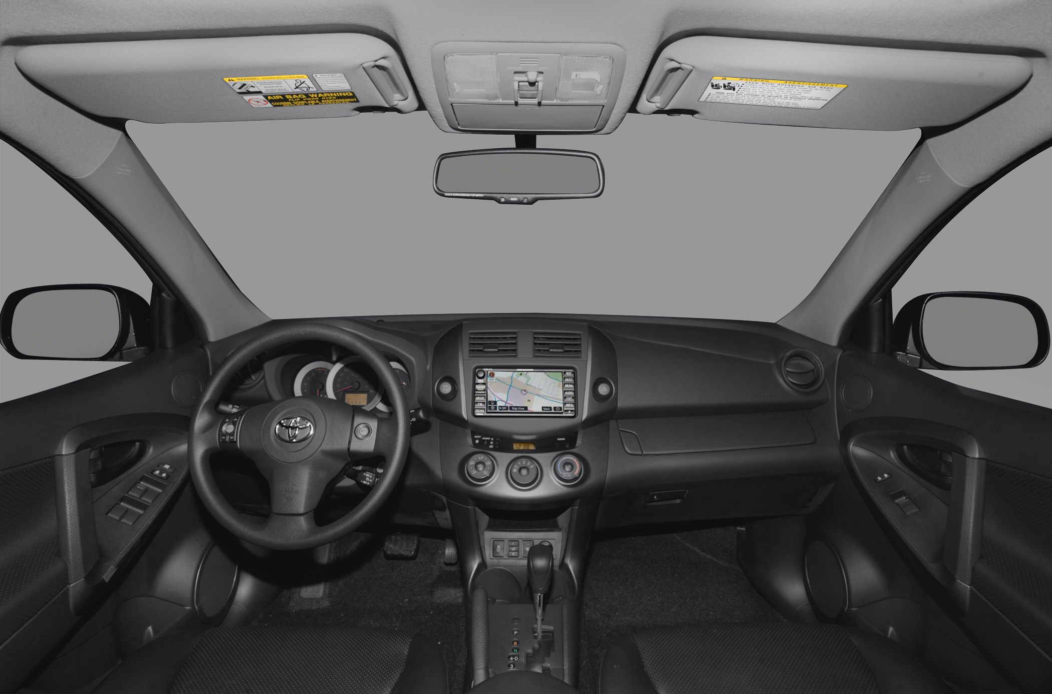 Dashboard with navigation screen, steering wheel, center console and gear shift